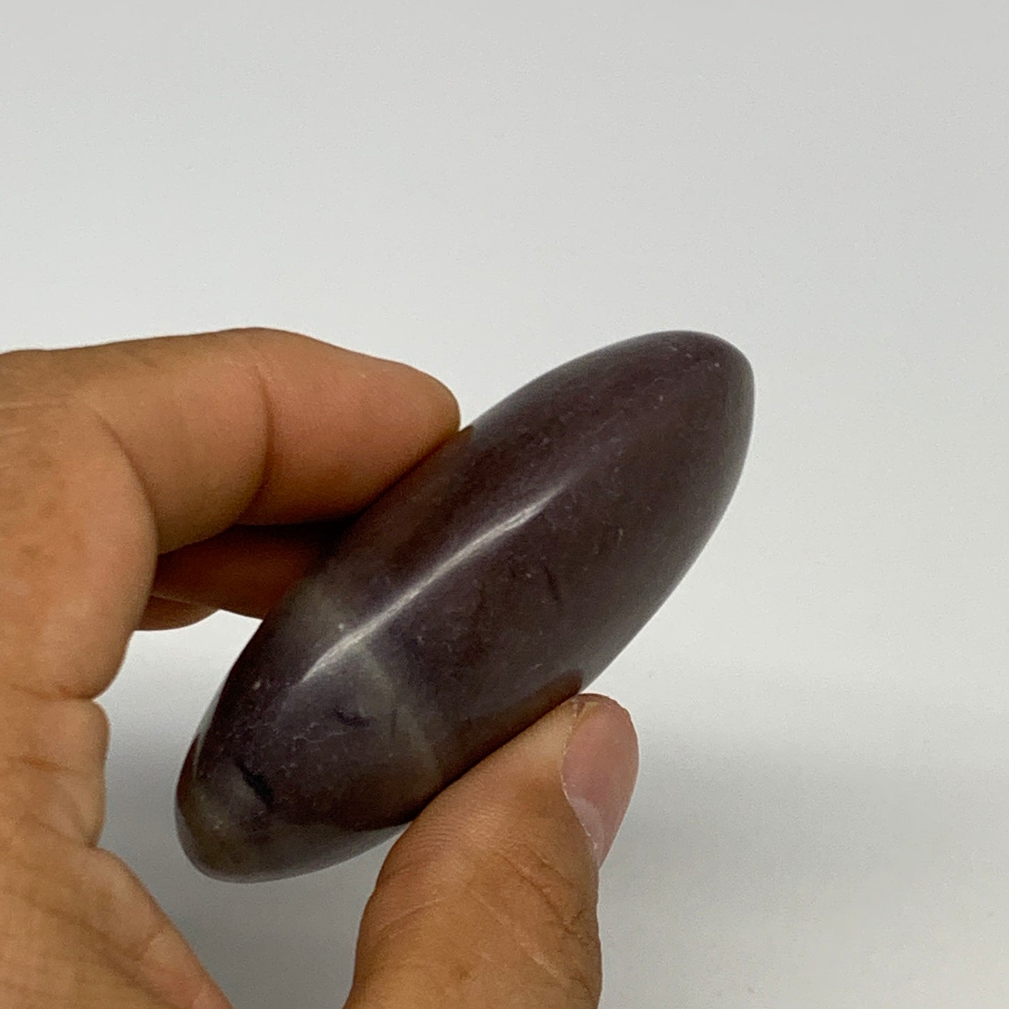 87.8g, 2.6"x1.6"x0.9", Narmada Shiva Lingam Palm-Stone Polished, B29386