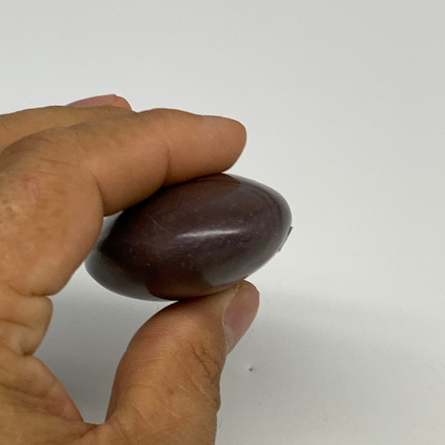 87.8g, 2.6"x1.6"x0.9", Narmada Shiva Lingam Palm-Stone Polished, B29386
