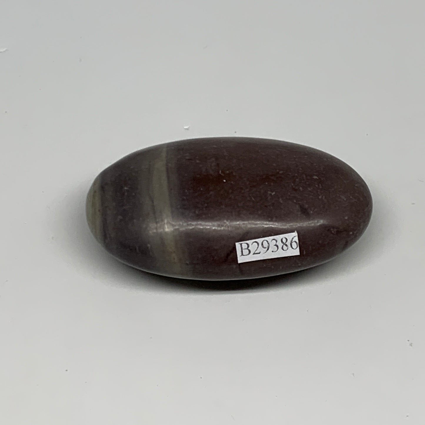 87.8g, 2.6"x1.6"x0.9", Narmada Shiva Lingam Palm-Stone Polished, B29386