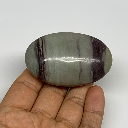 86.3g, 2.5"x1.6"x0.9", Narmada Shiva Lingam Palm-Stone Polished, B29394