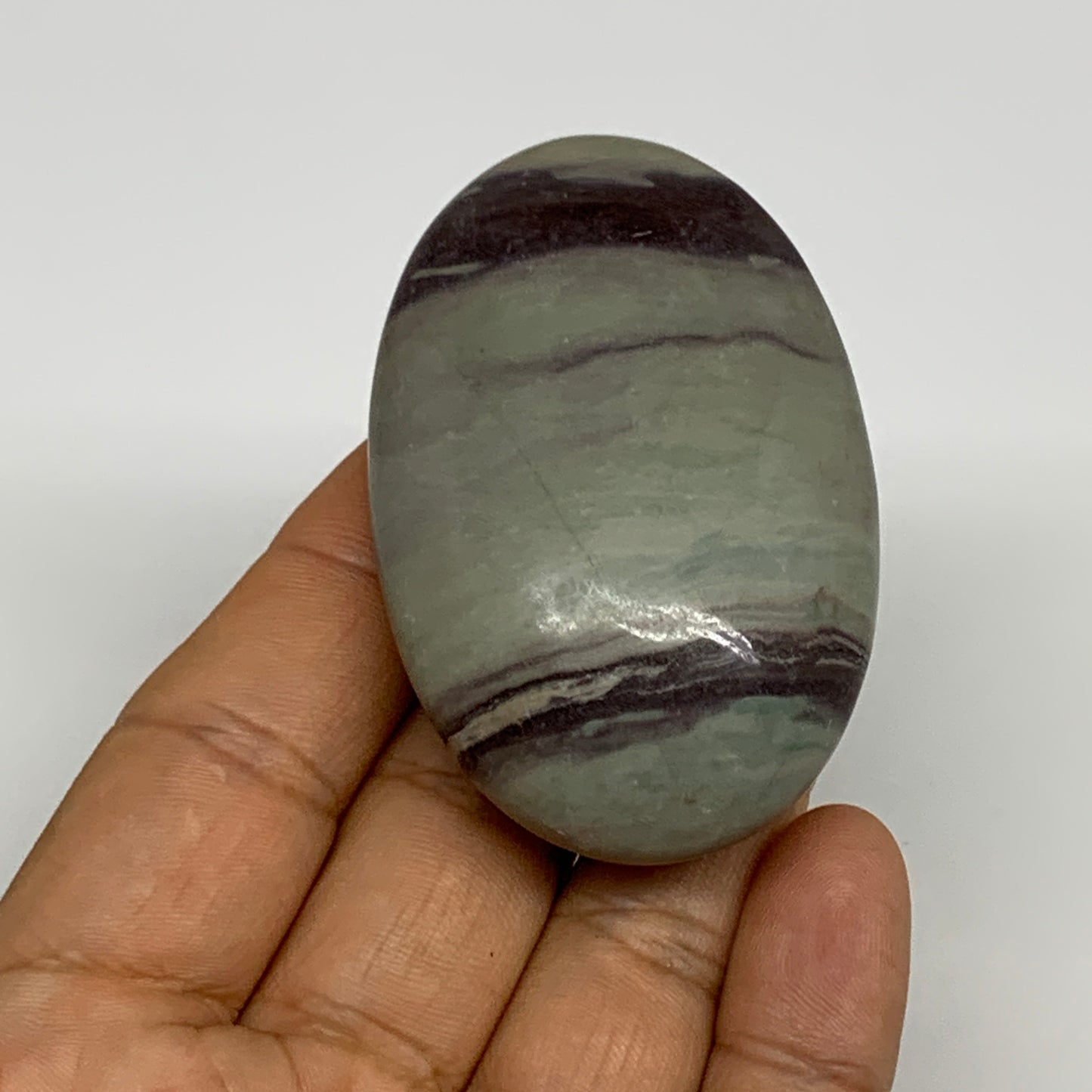 86.3g, 2.5"x1.6"x0.9", Narmada Shiva Lingam Palm-Stone Polished, B29394