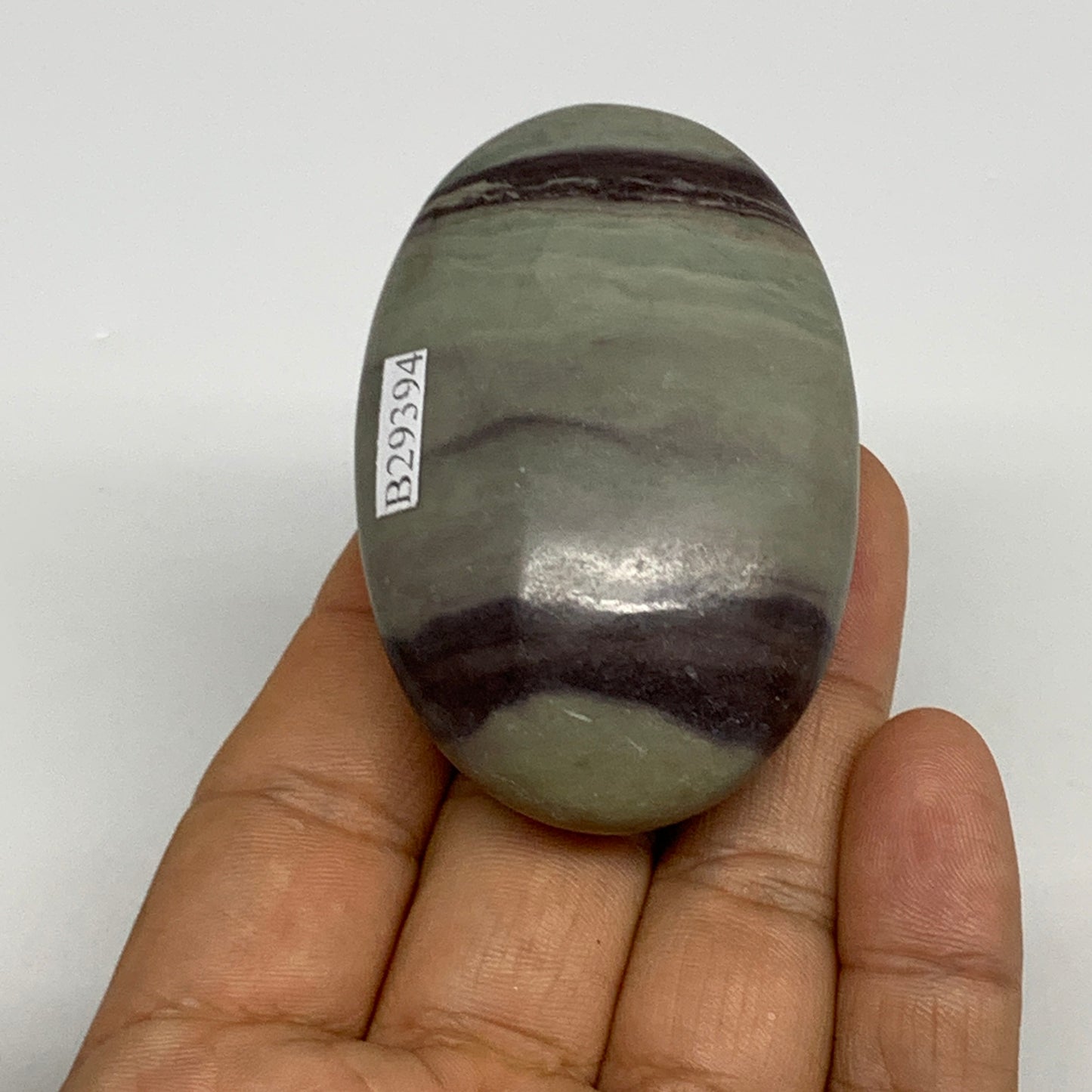 86.3g, 2.5"x1.6"x0.9", Narmada Shiva Lingam Palm-Stone Polished, B29394