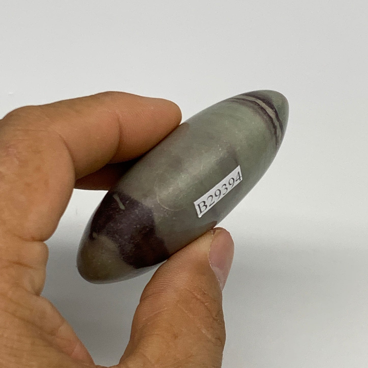 86.3g, 2.5"x1.6"x0.9", Narmada Shiva Lingam Palm-Stone Polished, B29394