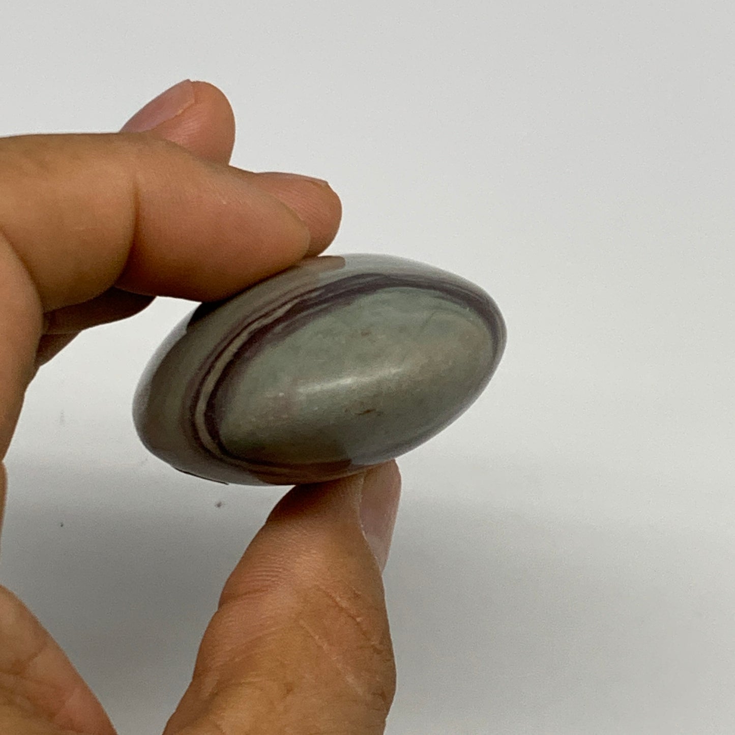 86.3g, 2.5"x1.6"x0.9", Narmada Shiva Lingam Palm-Stone Polished, B29394
