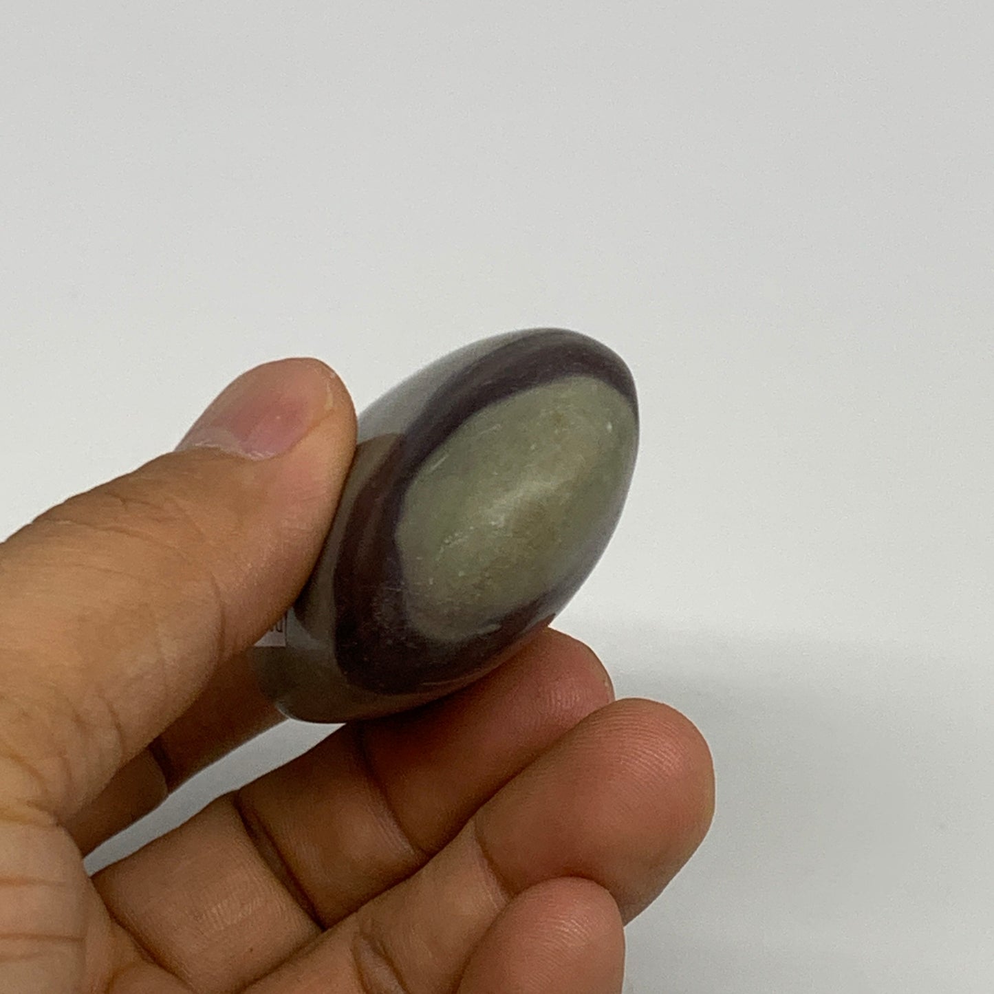 86.3g, 2.5"x1.6"x0.9", Narmada Shiva Lingam Palm-Stone Polished, B29394