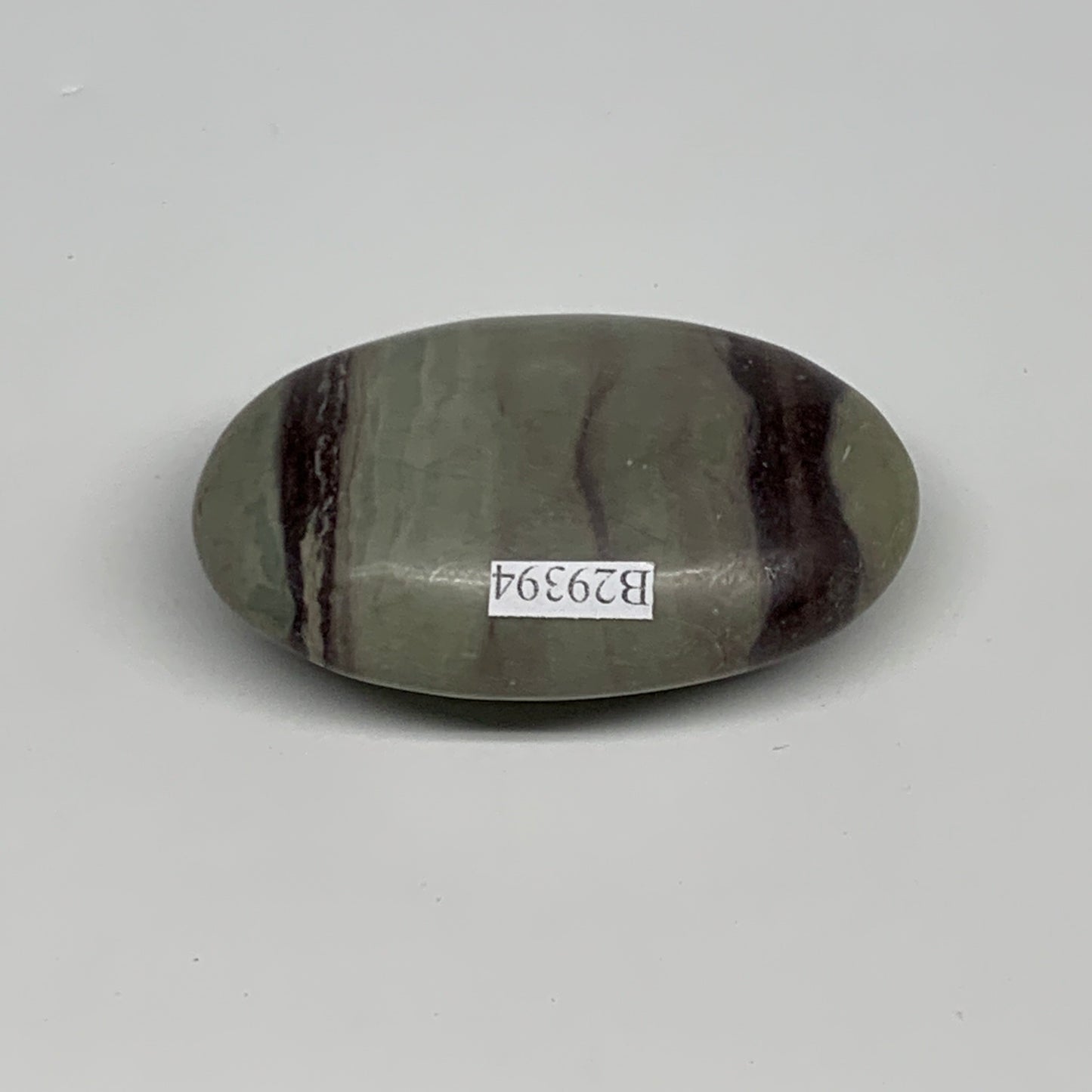 86.3g, 2.5"x1.6"x0.9", Narmada Shiva Lingam Palm-Stone Polished, B29394