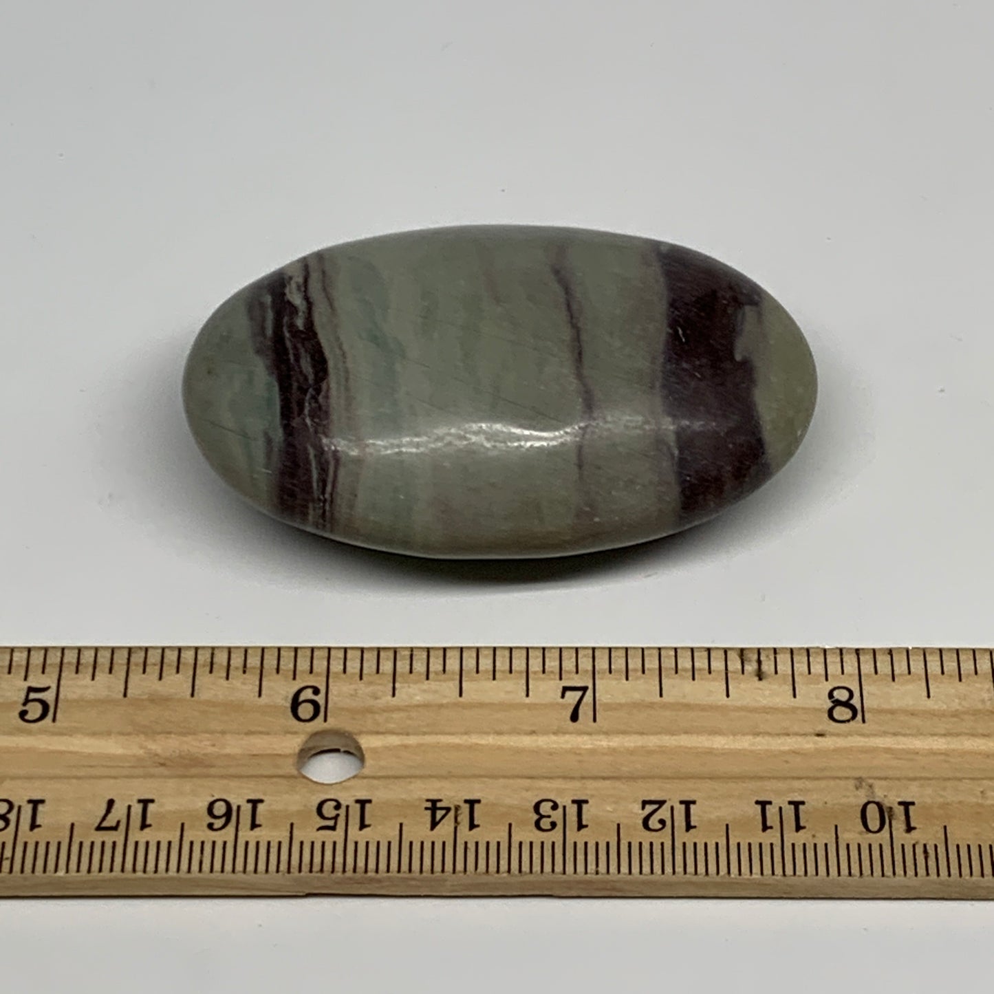 86.3g, 2.5"x1.6"x0.9", Narmada Shiva Lingam Palm-Stone Polished, B29394