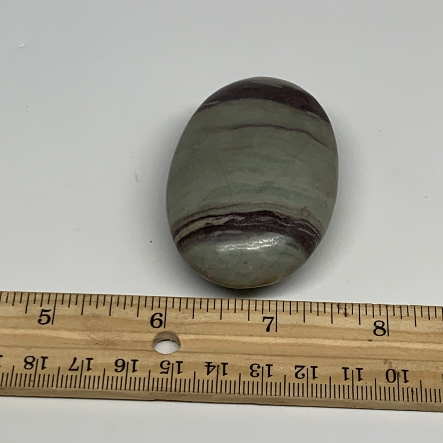 86.3g, 2.5"x1.6"x0.9", Narmada Shiva Lingam Palm-Stone Polished, B29394