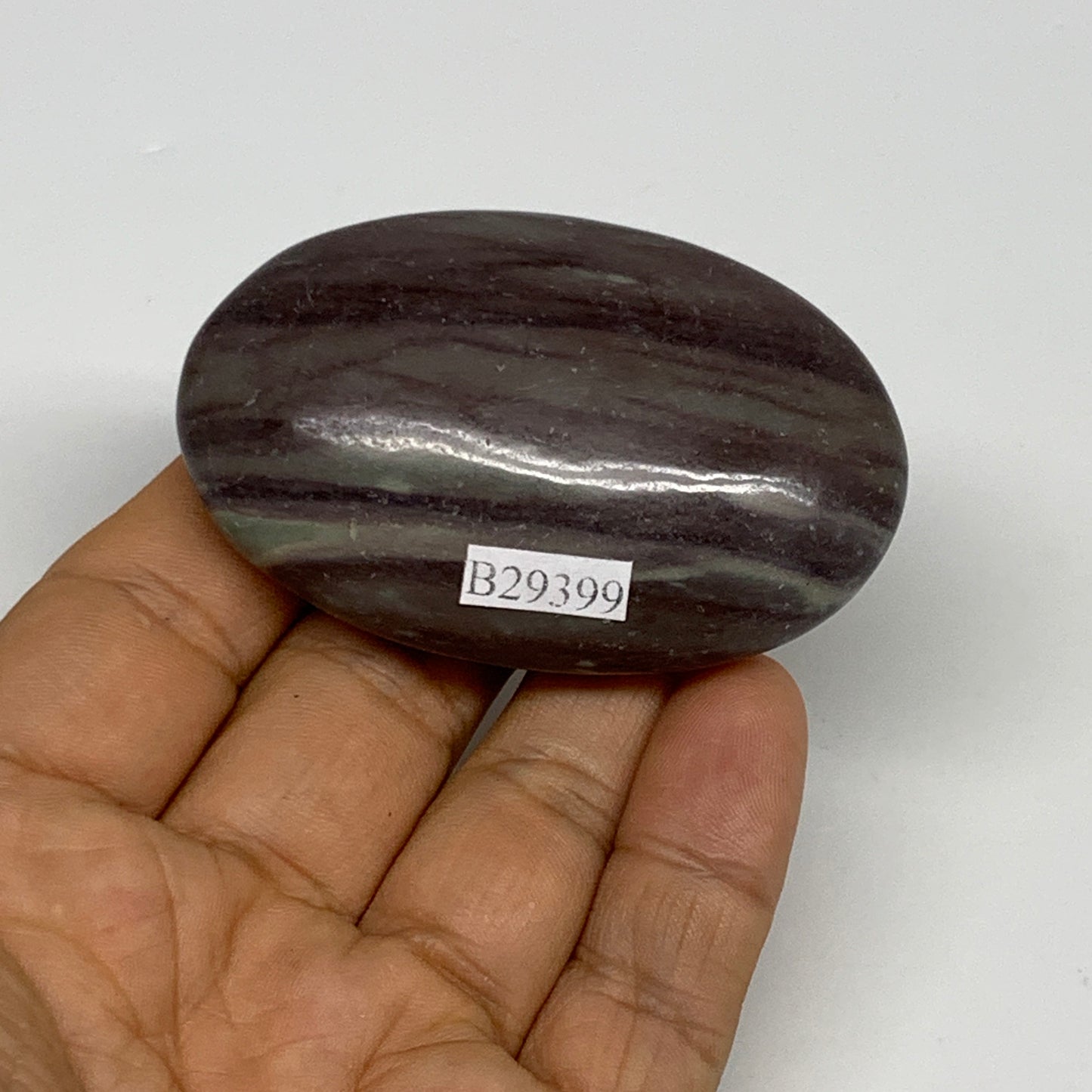 76.6g, 2.5"x1.6"x0.8", Narmada Shiva Lingam Palm-Stone Polished, B29399