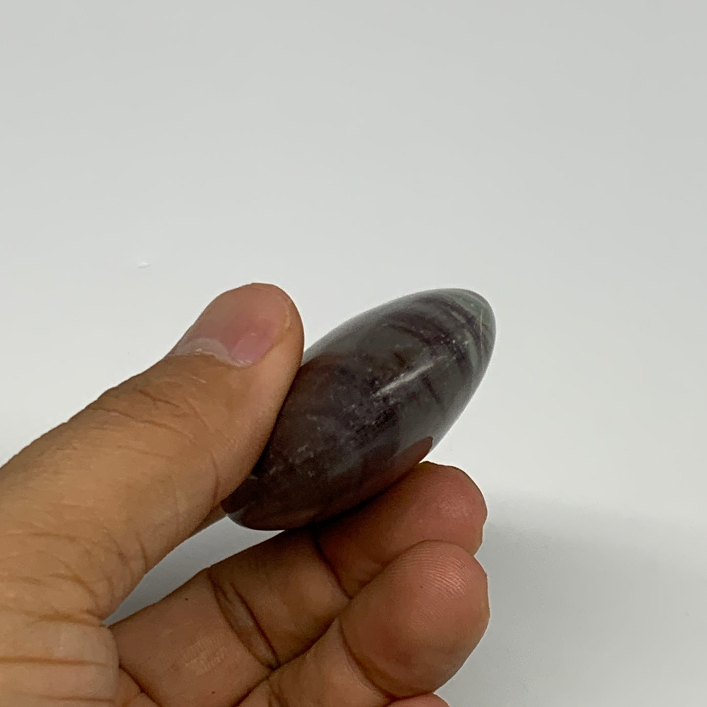 76.6g, 2.5"x1.6"x0.8", Narmada Shiva Lingam Palm-Stone Polished, B29399