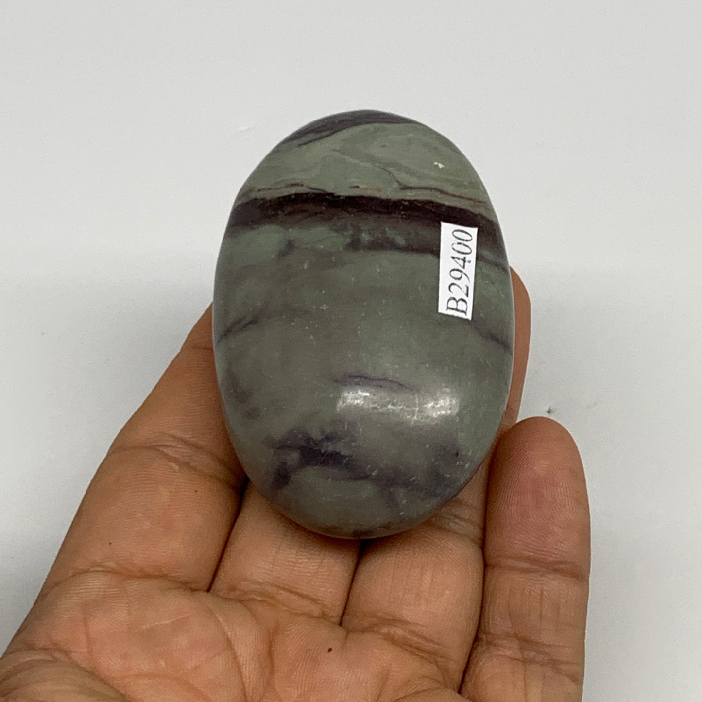 100g,  2.5"x1.7"x1", Narmada Shiva Lingam Palm-Stone Polished, B29400