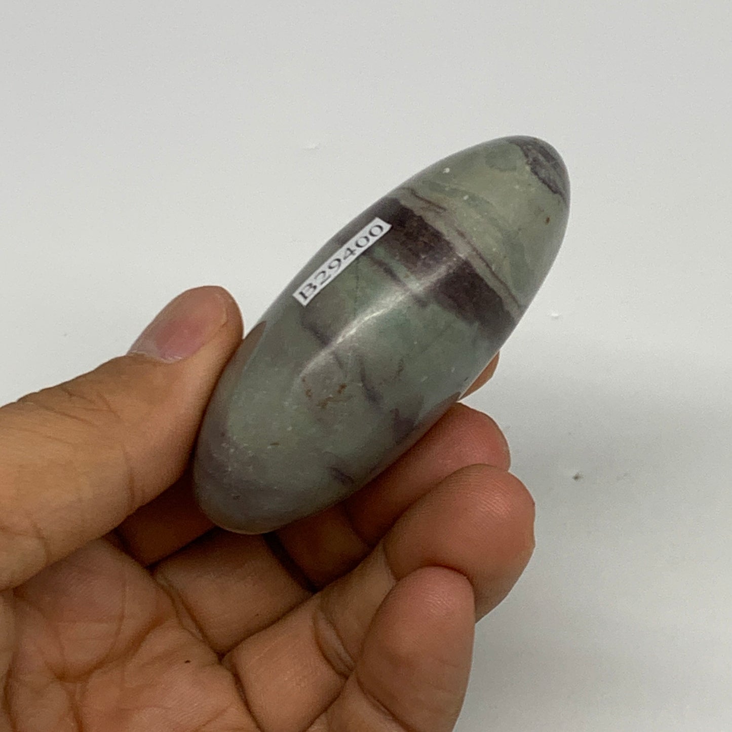 100g,  2.5"x1.7"x1", Narmada Shiva Lingam Palm-Stone Polished, B29400