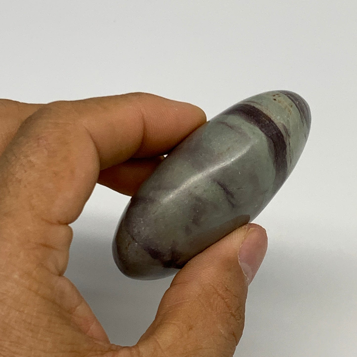 100g,  2.5"x1.7"x1", Narmada Shiva Lingam Palm-Stone Polished, B29400