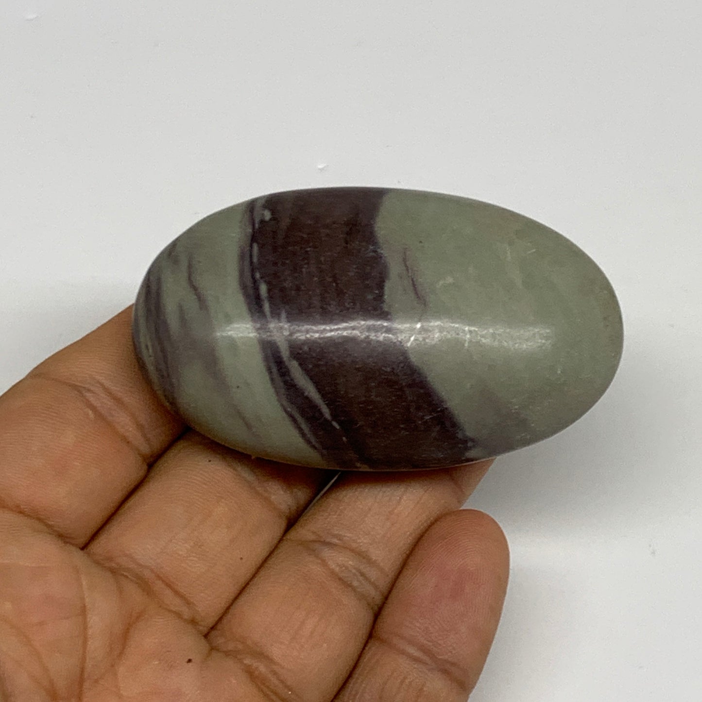 76.8g,  2.5"x1.5"x0.9", Narmada Shiva Lingam Palm-Stone Polished, B29402