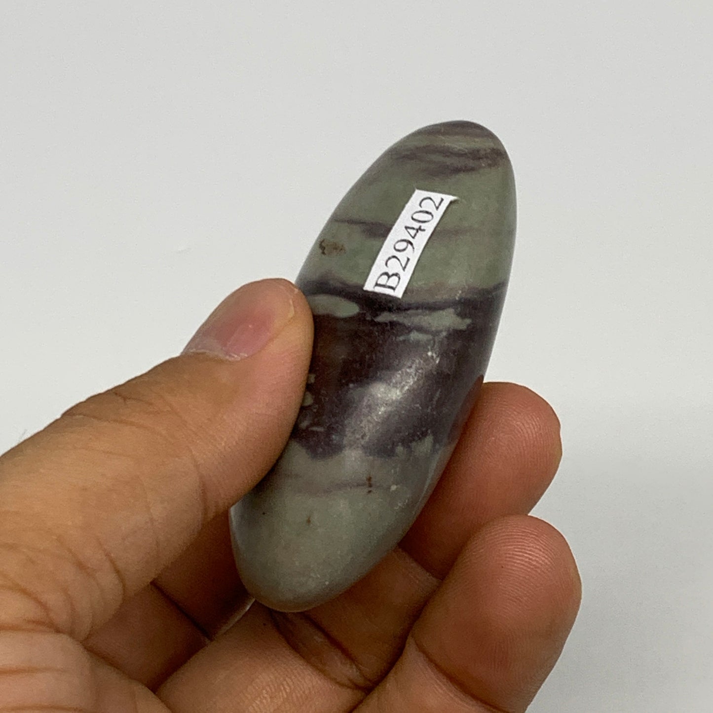 76.8g,  2.5"x1.5"x0.9", Narmada Shiva Lingam Palm-Stone Polished, B29402