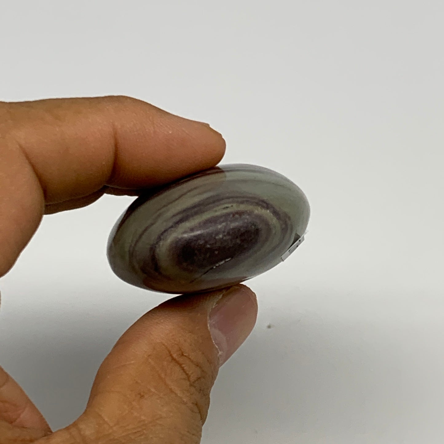 76.8g,  2.5"x1.5"x0.9", Narmada Shiva Lingam Palm-Stone Polished, B29402