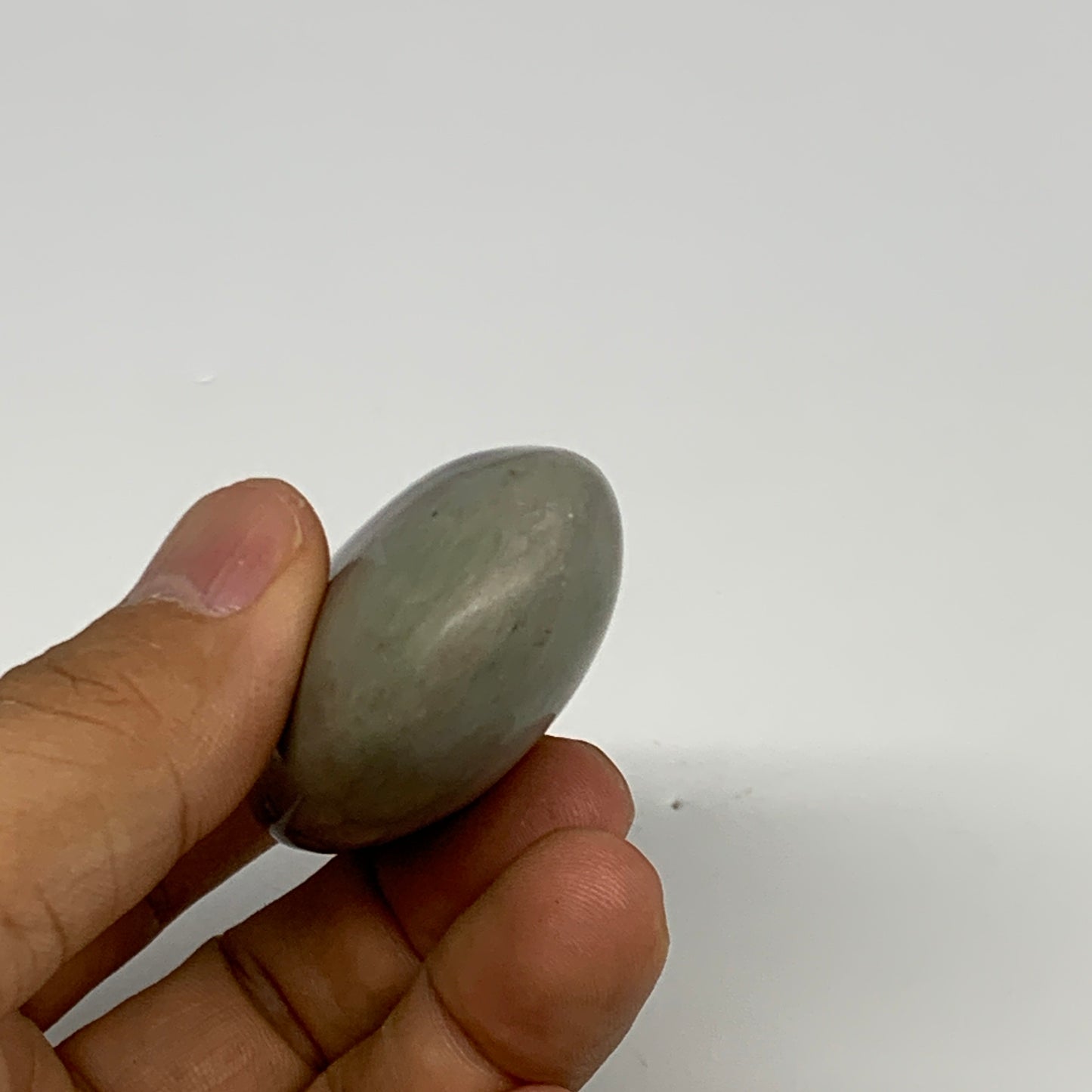 76.8g,  2.5"x1.5"x0.9", Narmada Shiva Lingam Palm-Stone Polished, B29402