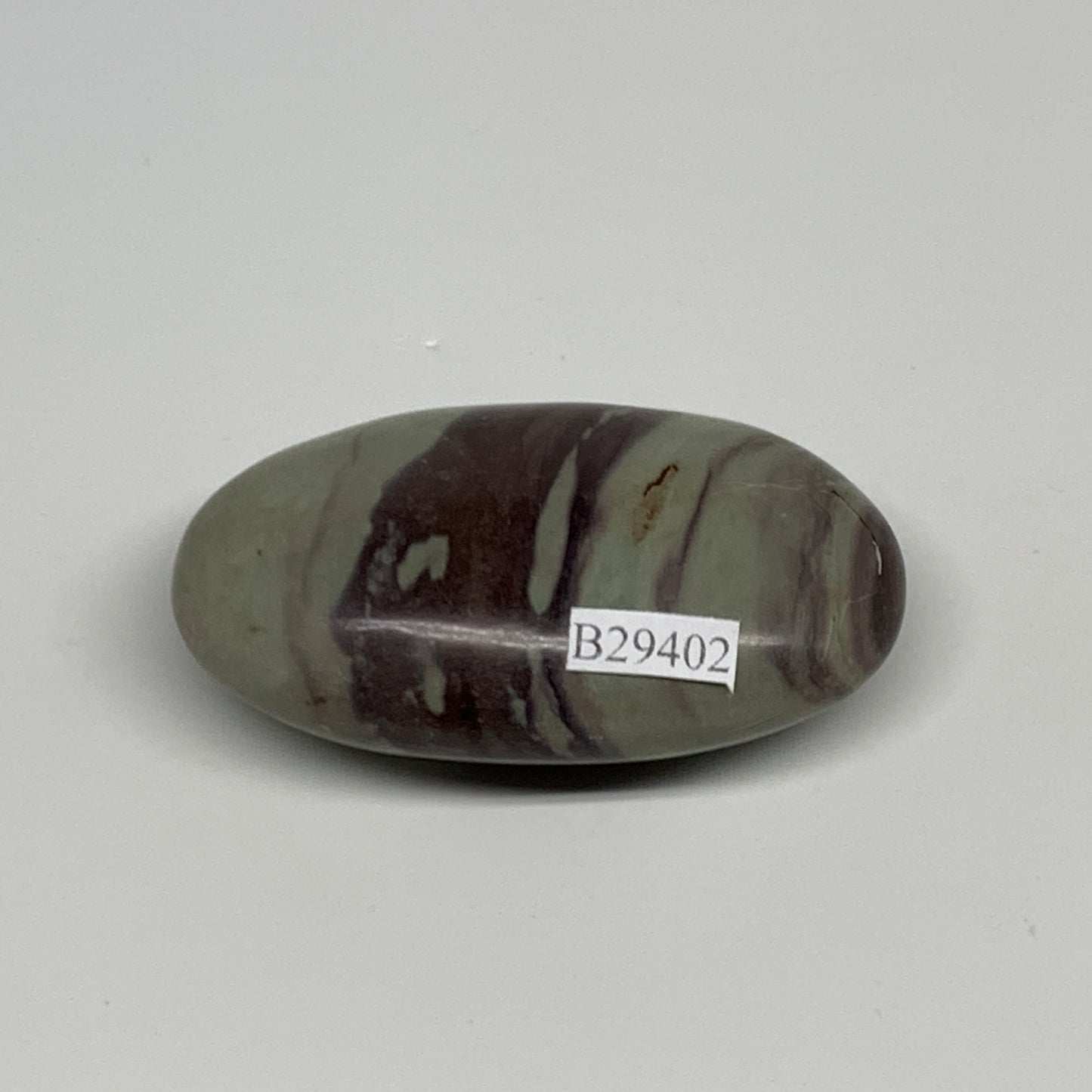 76.8g,  2.5"x1.5"x0.9", Narmada Shiva Lingam Palm-Stone Polished, B29402