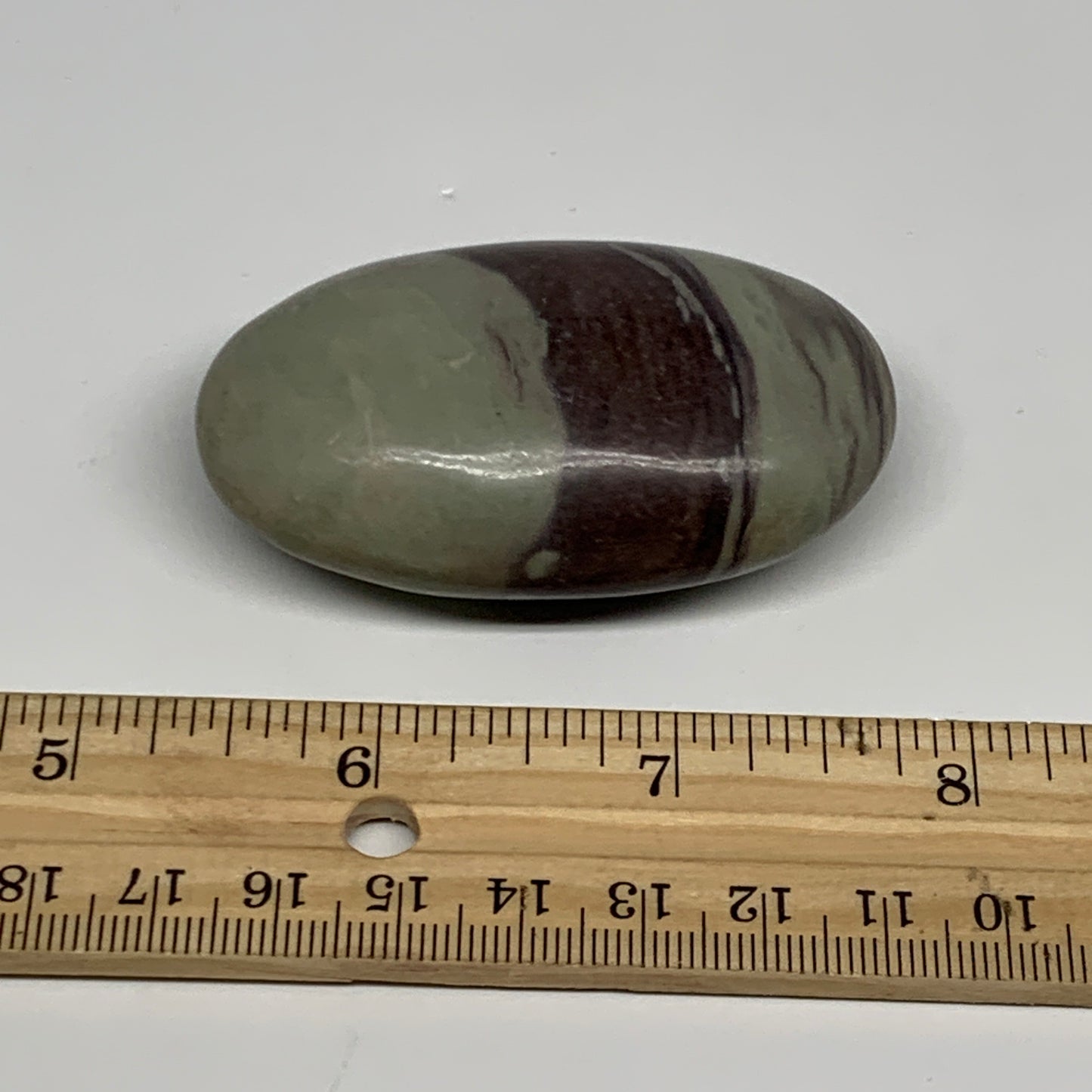 76.8g,  2.5"x1.5"x0.9", Narmada Shiva Lingam Palm-Stone Polished, B29402