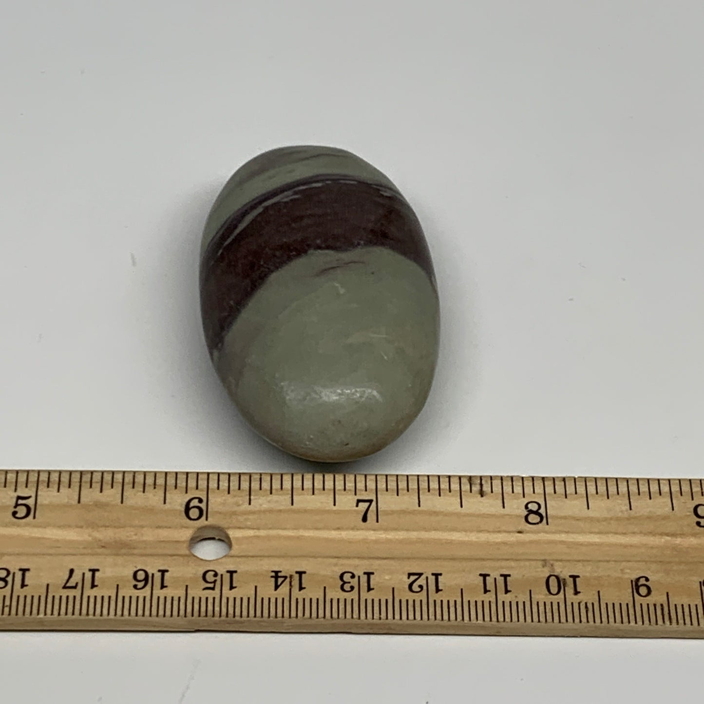 76.8g,  2.5"x1.5"x0.9", Narmada Shiva Lingam Palm-Stone Polished, B29402