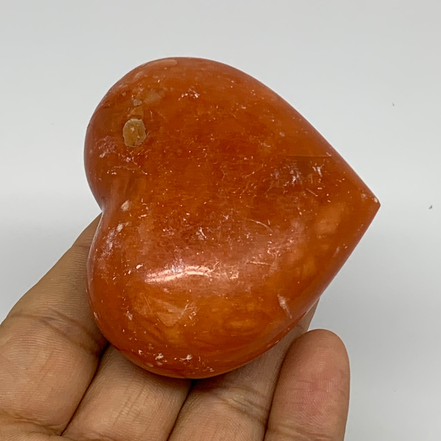 125.2g, 2.2"x2.6"x1.1" Orange Calcite Heart Gemstones from Madagascar, B33766