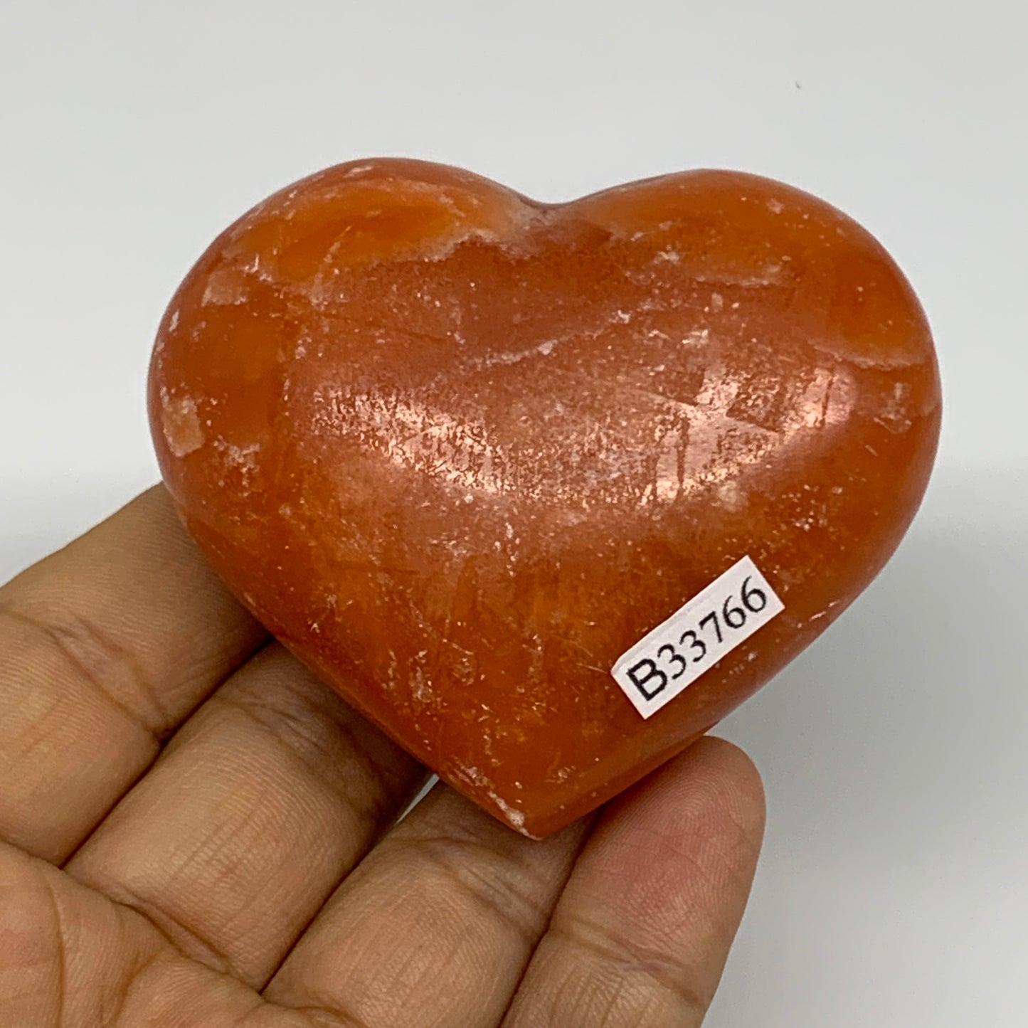 125.2g, 2.2"x2.6"x1.1" Orange Calcite Heart Gemstones from Madagascar, B33766