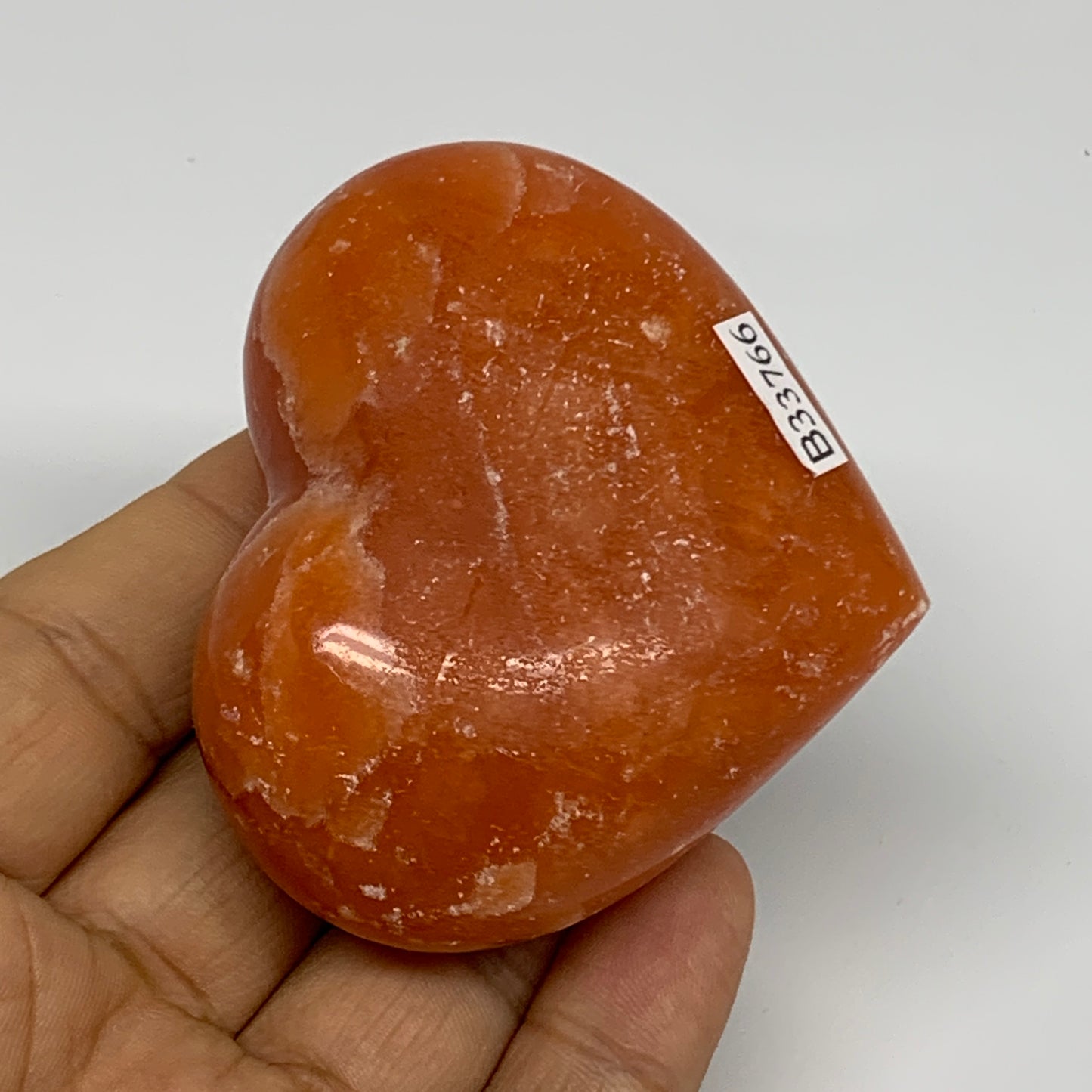 125.2g, 2.2"x2.6"x1.1" Orange Calcite Heart Gemstones from Madagascar, B33766