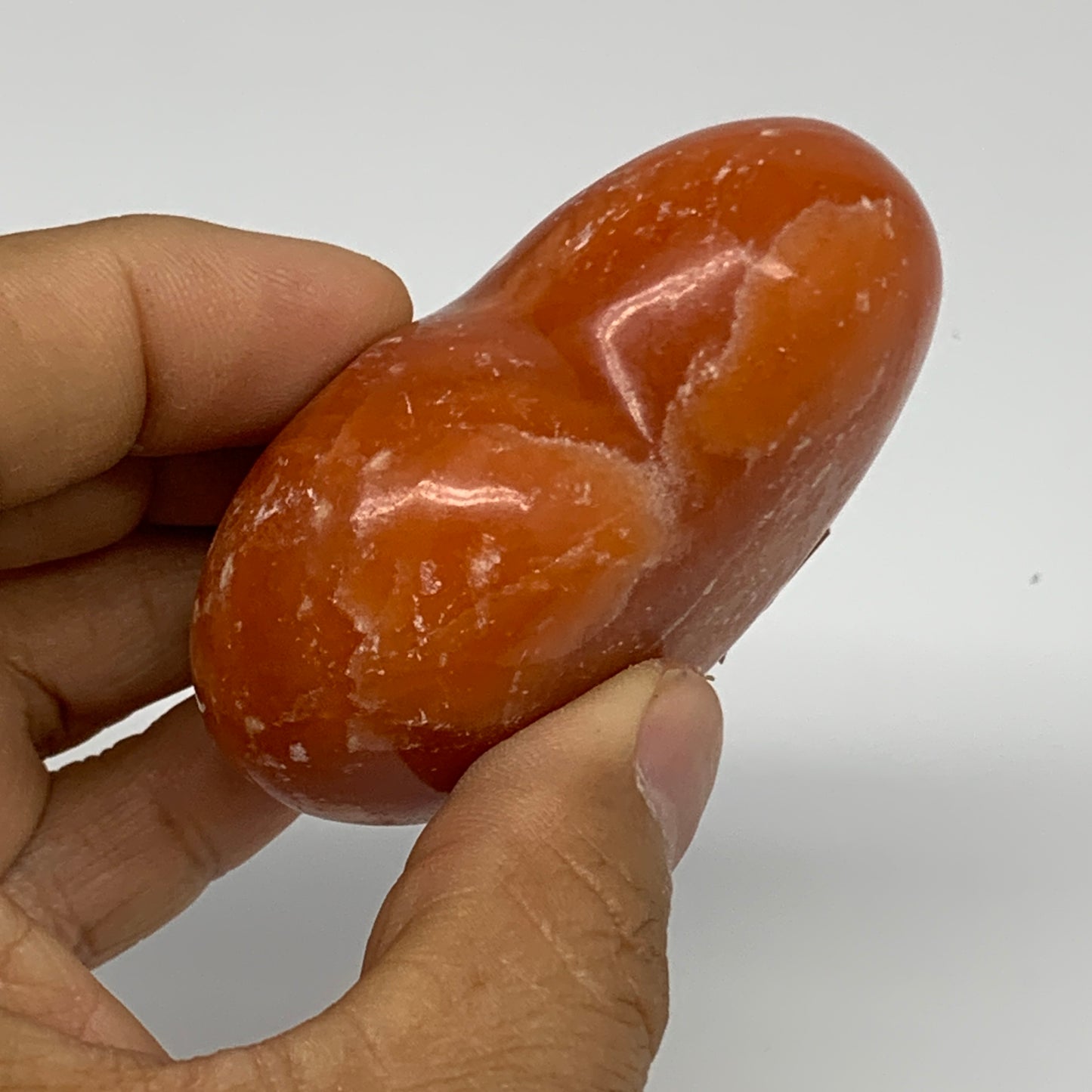 125.2g, 2.2"x2.6"x1.1" Orange Calcite Heart Gemstones from Madagascar, B33766