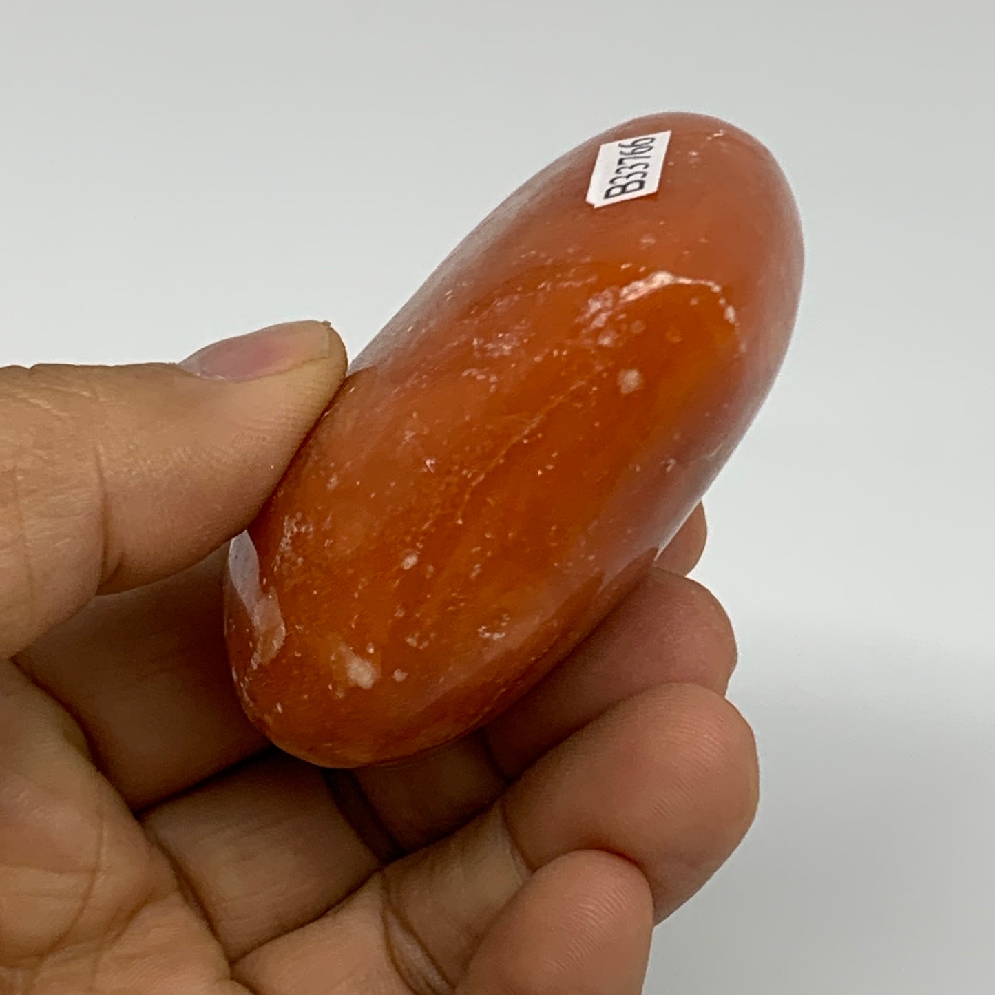 125.2g, 2.2"x2.6"x1.1" Orange Calcite Heart Gemstones from Madagascar, B33766