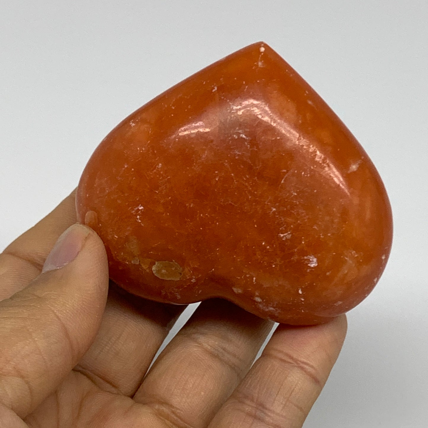 125.2g, 2.2"x2.6"x1.1" Orange Calcite Heart Gemstones from Madagascar, B33766