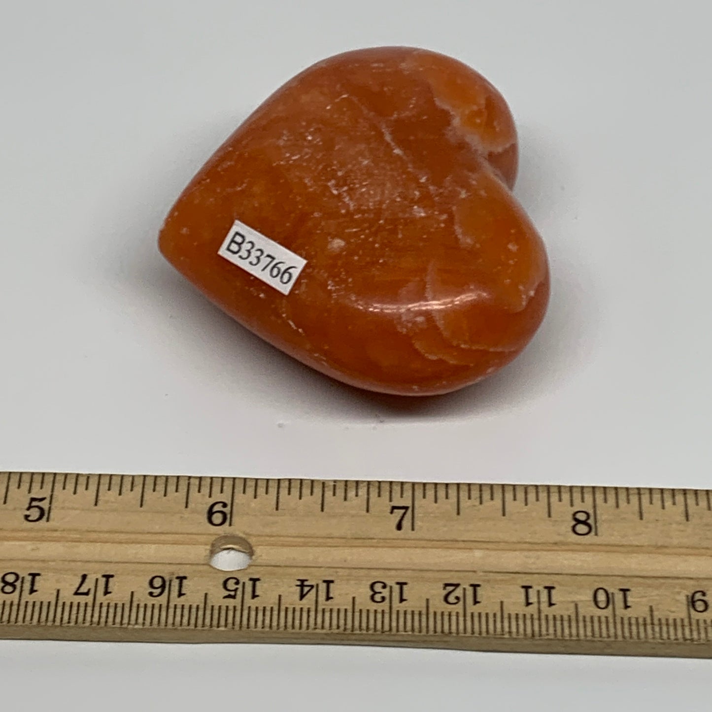 125.2g, 2.2"x2.6"x1.1" Orange Calcite Heart Gemstones from Madagascar, B33766
