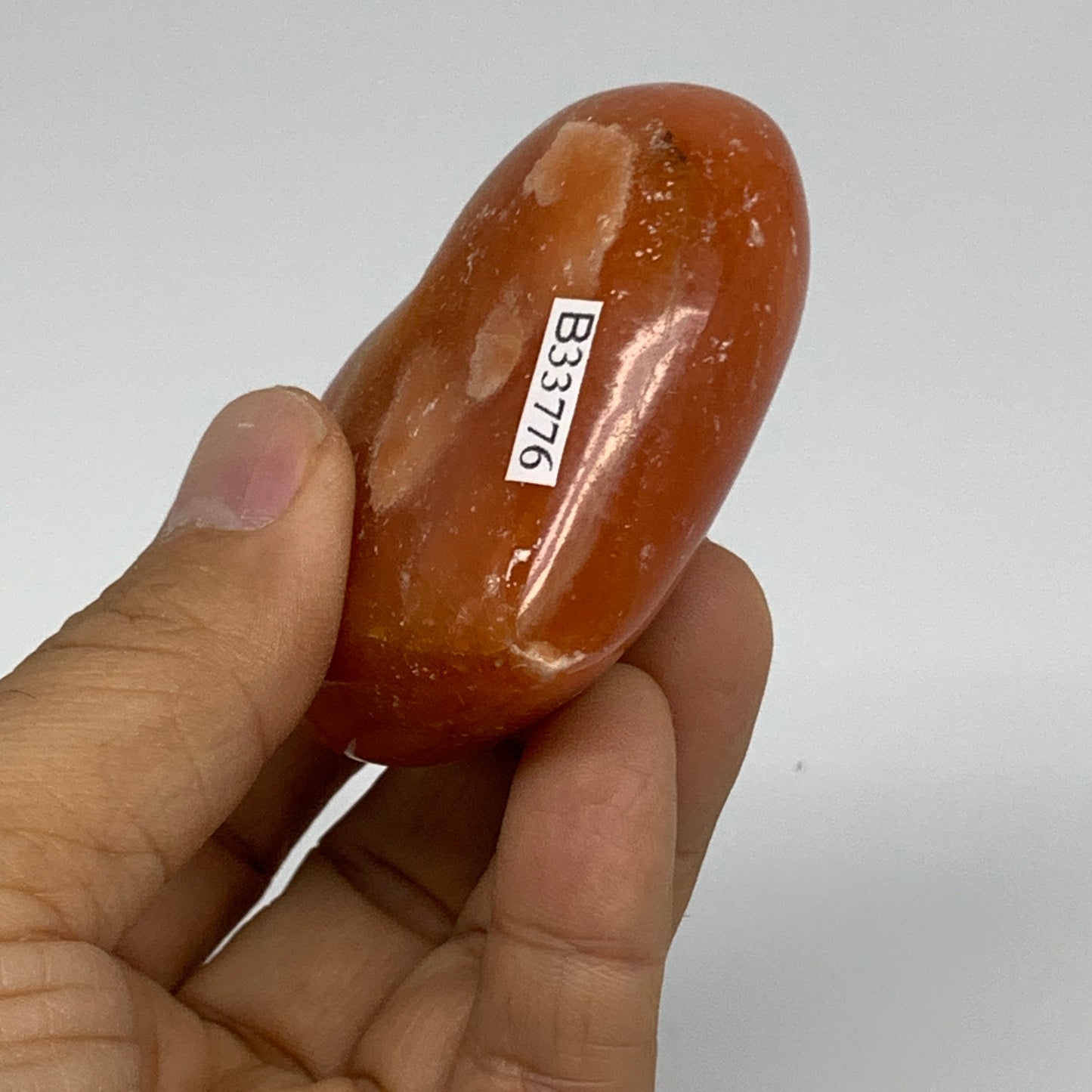 112.7g, 2.1"x2.5"x1.1" Orange Calcite Heart Gemstones from Madagascar, B33776