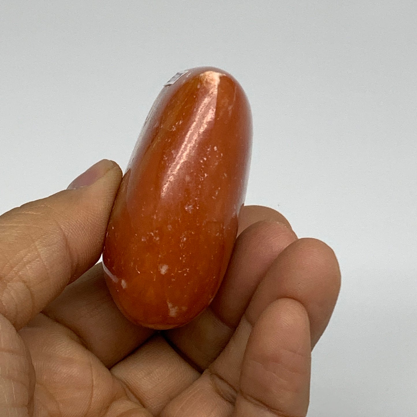 112.7g, 2.1"x2.5"x1.1" Orange Calcite Heart Gemstones from Madagascar, B33776