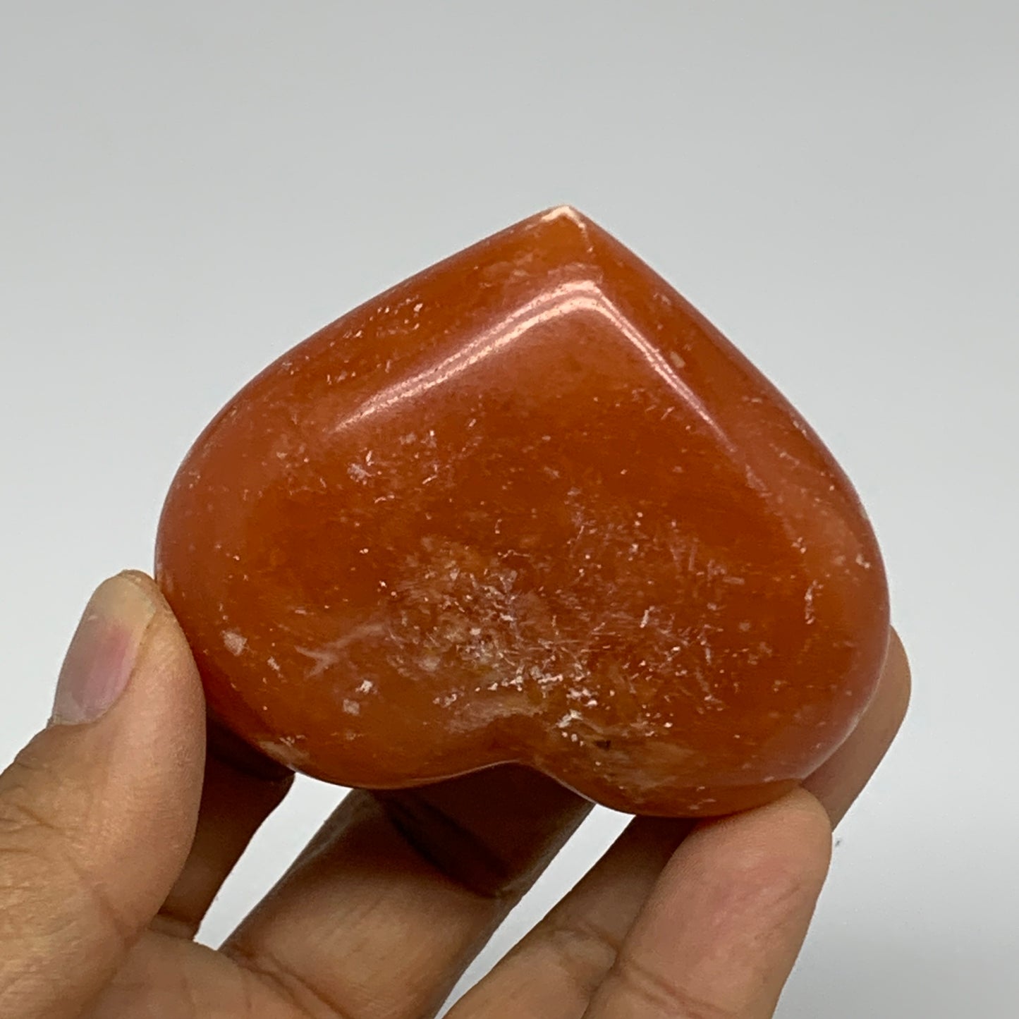 112.7g, 2.1"x2.5"x1.1" Orange Calcite Heart Gemstones from Madagascar, B33776