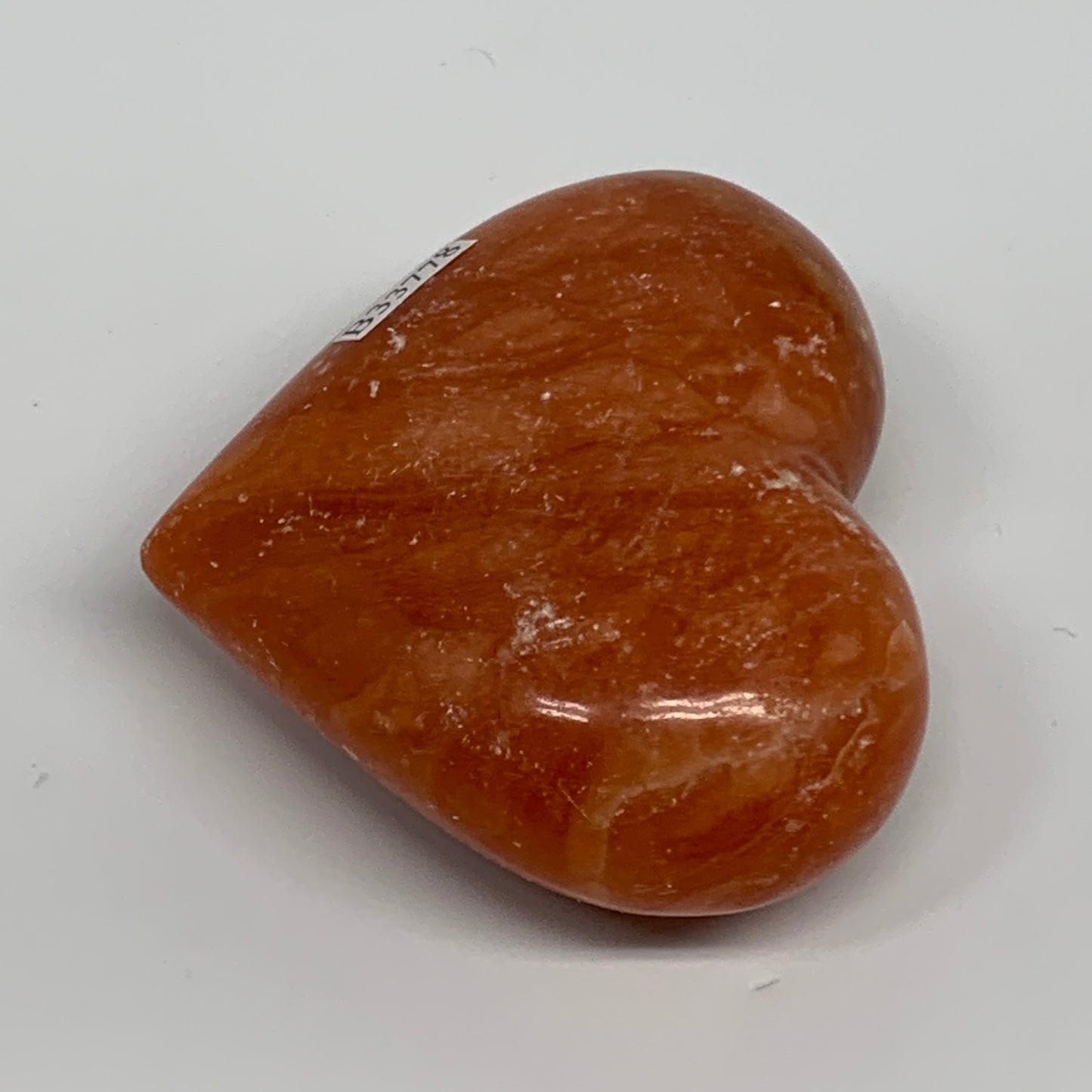 146g, 2.4"x2.8"x1.1" Orange Calcite Heart Gemstones from Madagascar, B33778