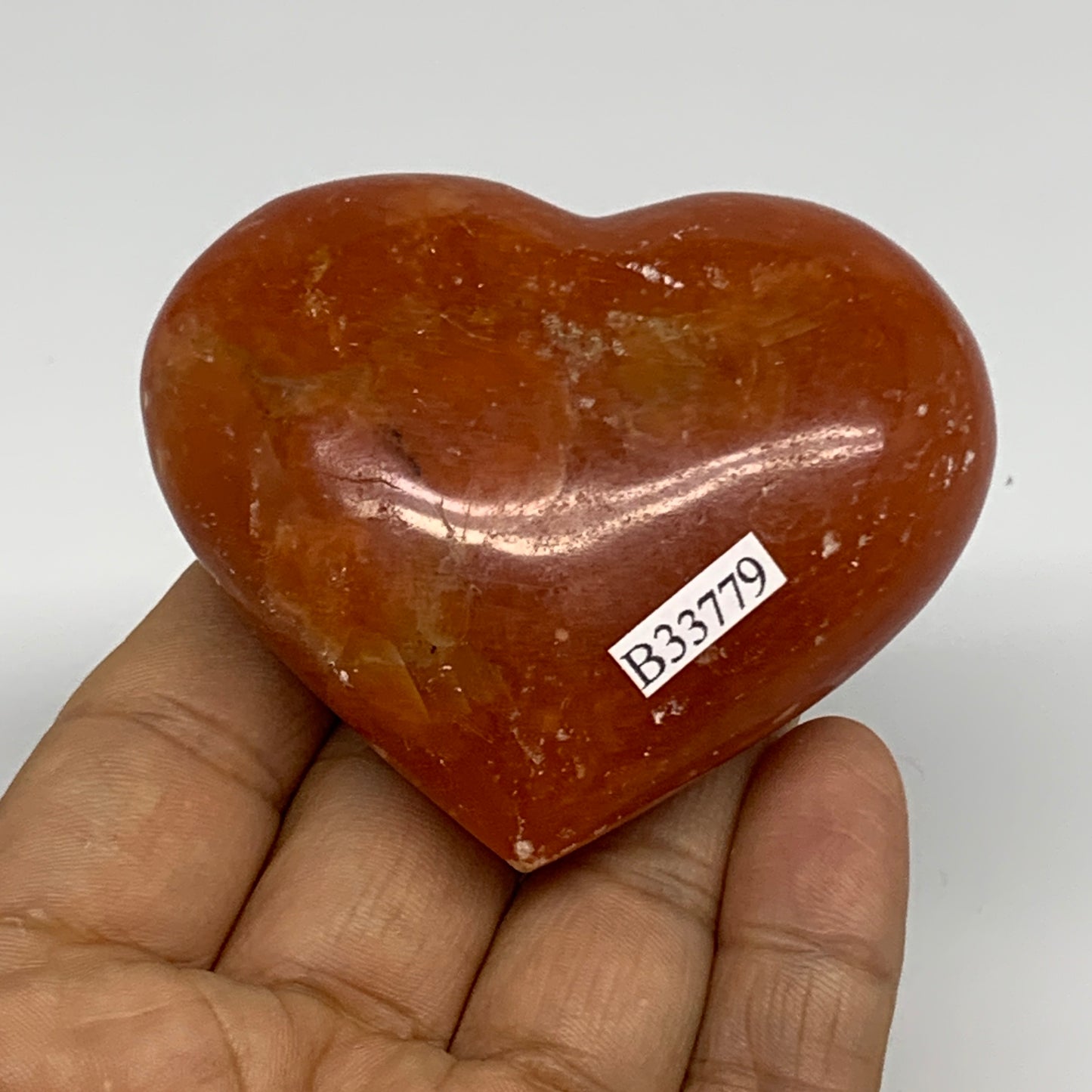 126.9g, 2.2"x2.7"x1.1" Orange Calcite Heart Gemstones from Madagascar, B33779