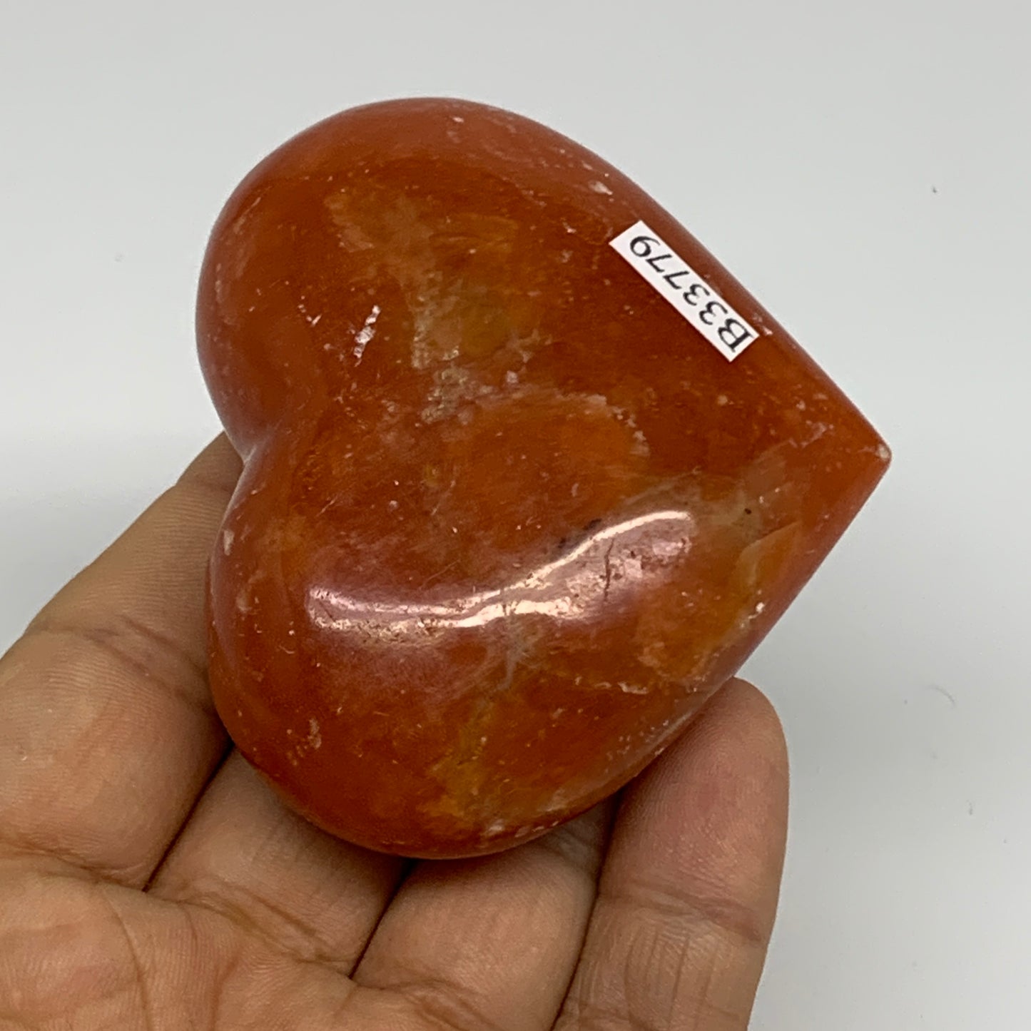 126.9g, 2.2"x2.7"x1.1" Orange Calcite Heart Gemstones from Madagascar, B33779