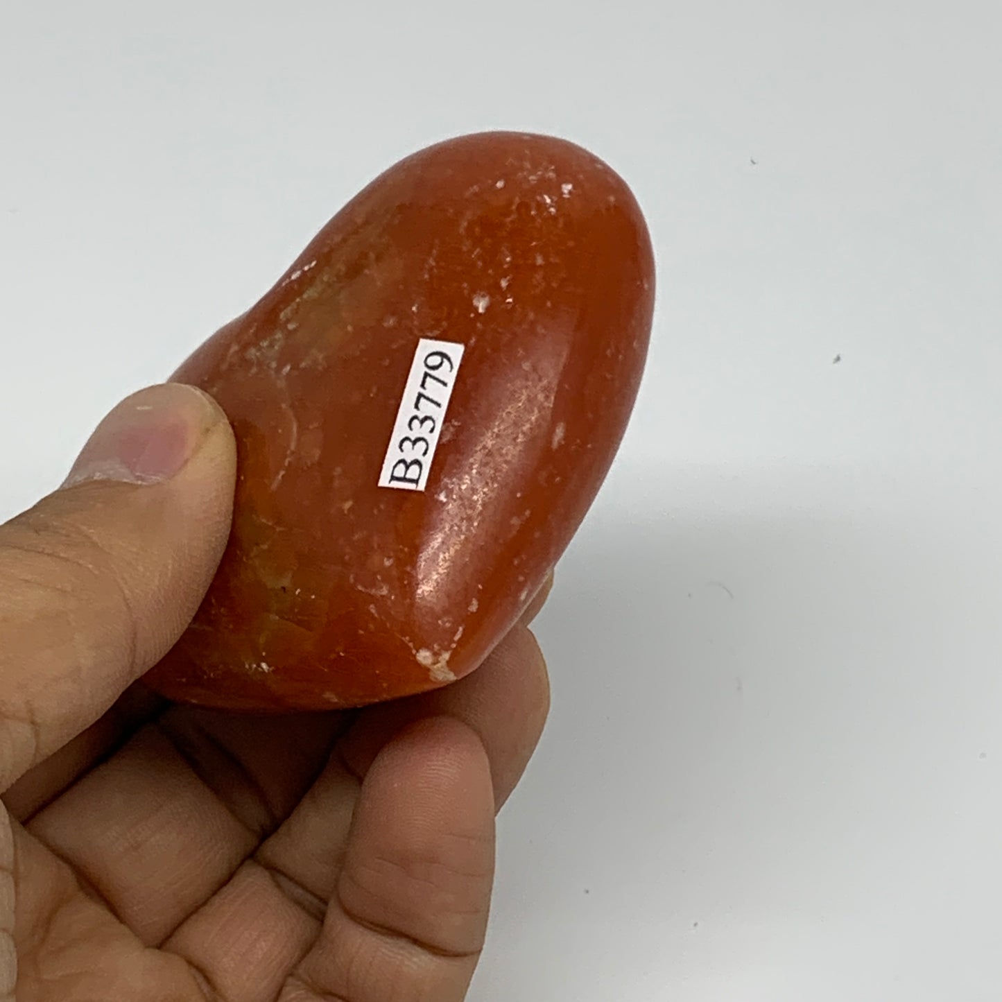 126.9g, 2.2"x2.7"x1.1" Orange Calcite Heart Gemstones from Madagascar, B33779