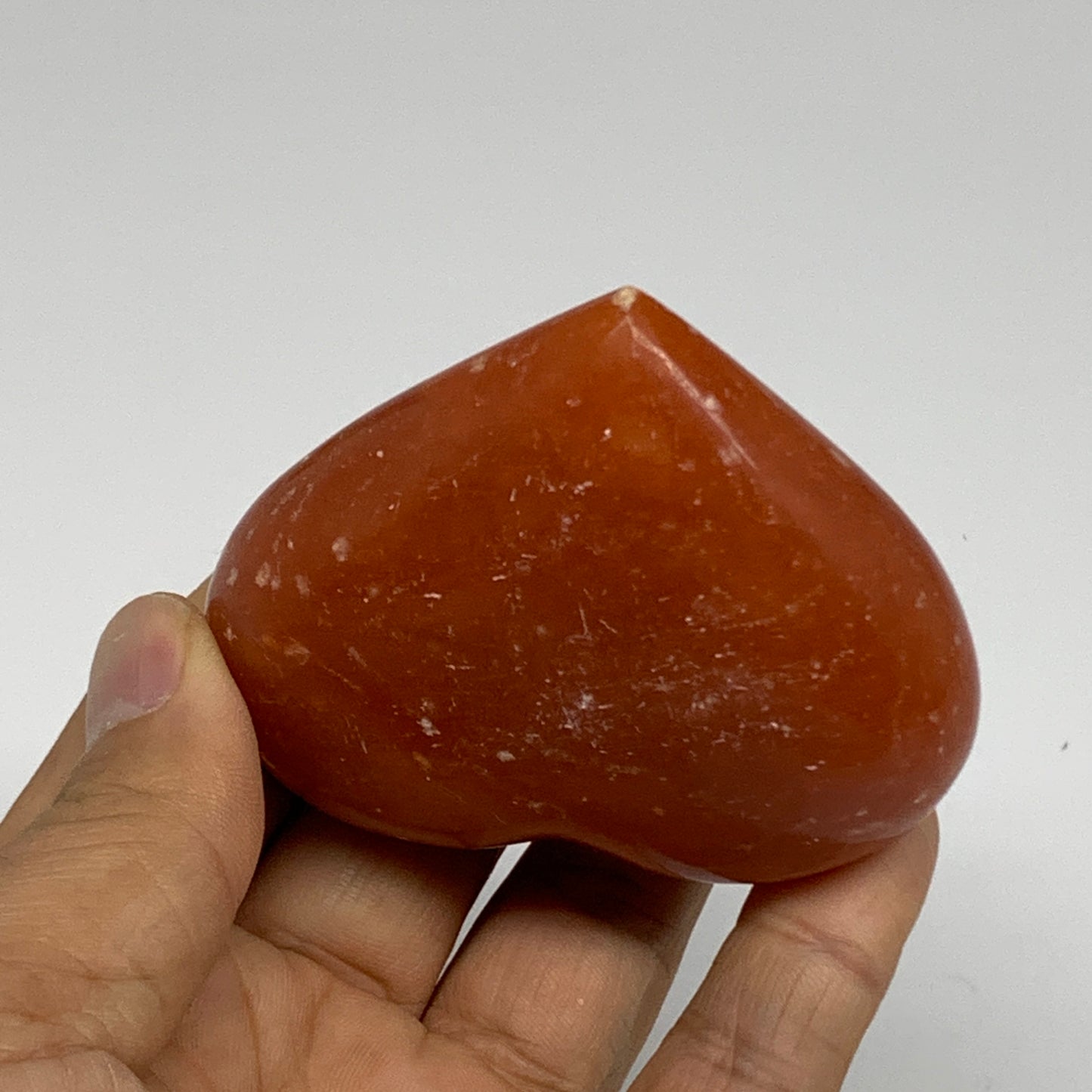 126.9g, 2.2"x2.7"x1.1" Orange Calcite Heart Gemstones from Madagascar, B33779
