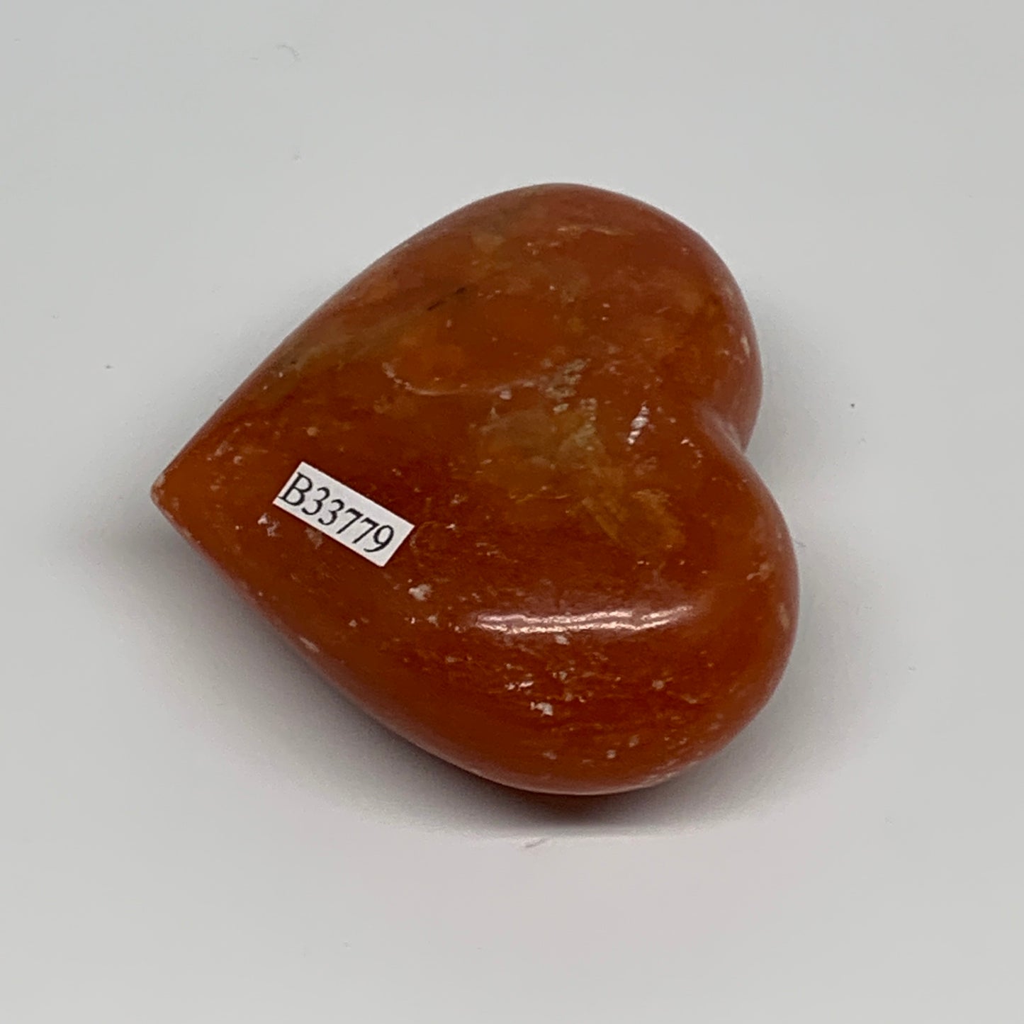 126.9g, 2.2"x2.7"x1.1" Orange Calcite Heart Gemstones from Madagascar, B33779