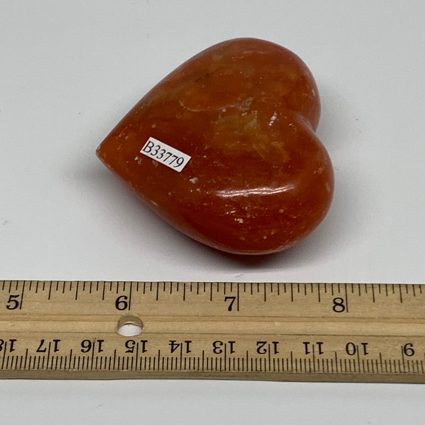 126.9g, 2.2"x2.7"x1.1" Orange Calcite Heart Gemstones from Madagascar, B33779