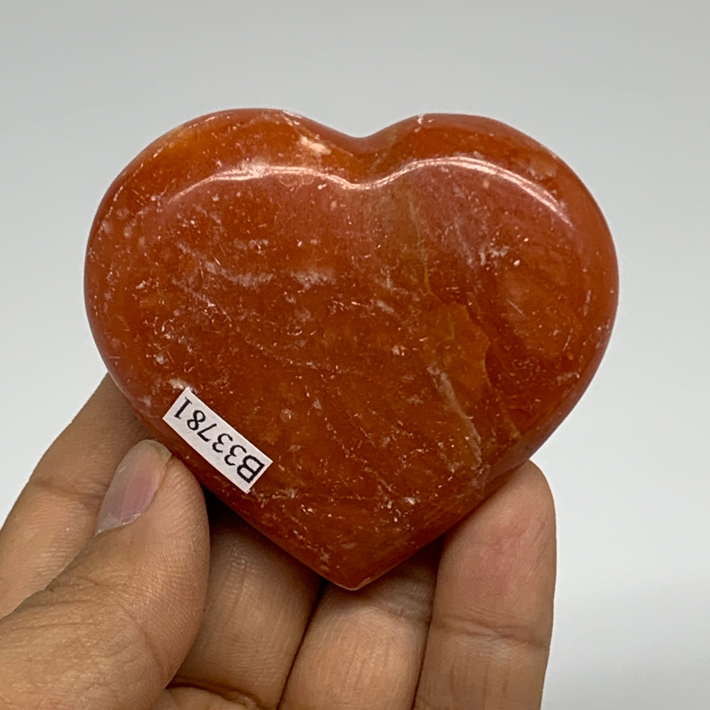 96.6g, 2.2"x2.5"x0.9" Orange Calcite Heart Gemstones from Madagascar, B33781