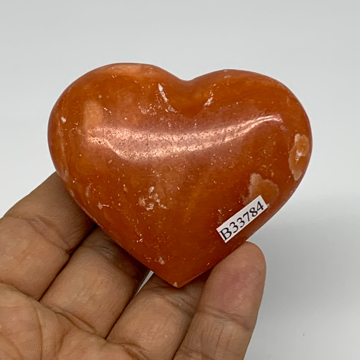 109.9g, 2.2"x2.6"x1" Orange Calcite Heart Gemstones from Madagascar, B33784