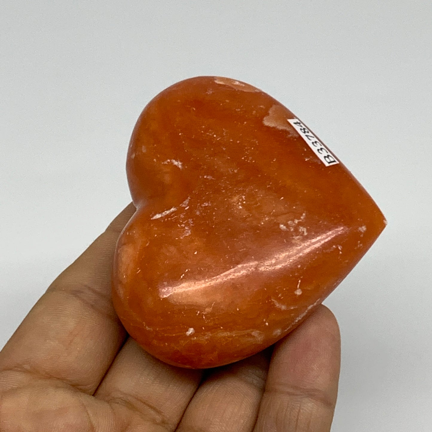 109.9g, 2.2"x2.6"x1" Orange Calcite Heart Gemstones from Madagascar, B33784