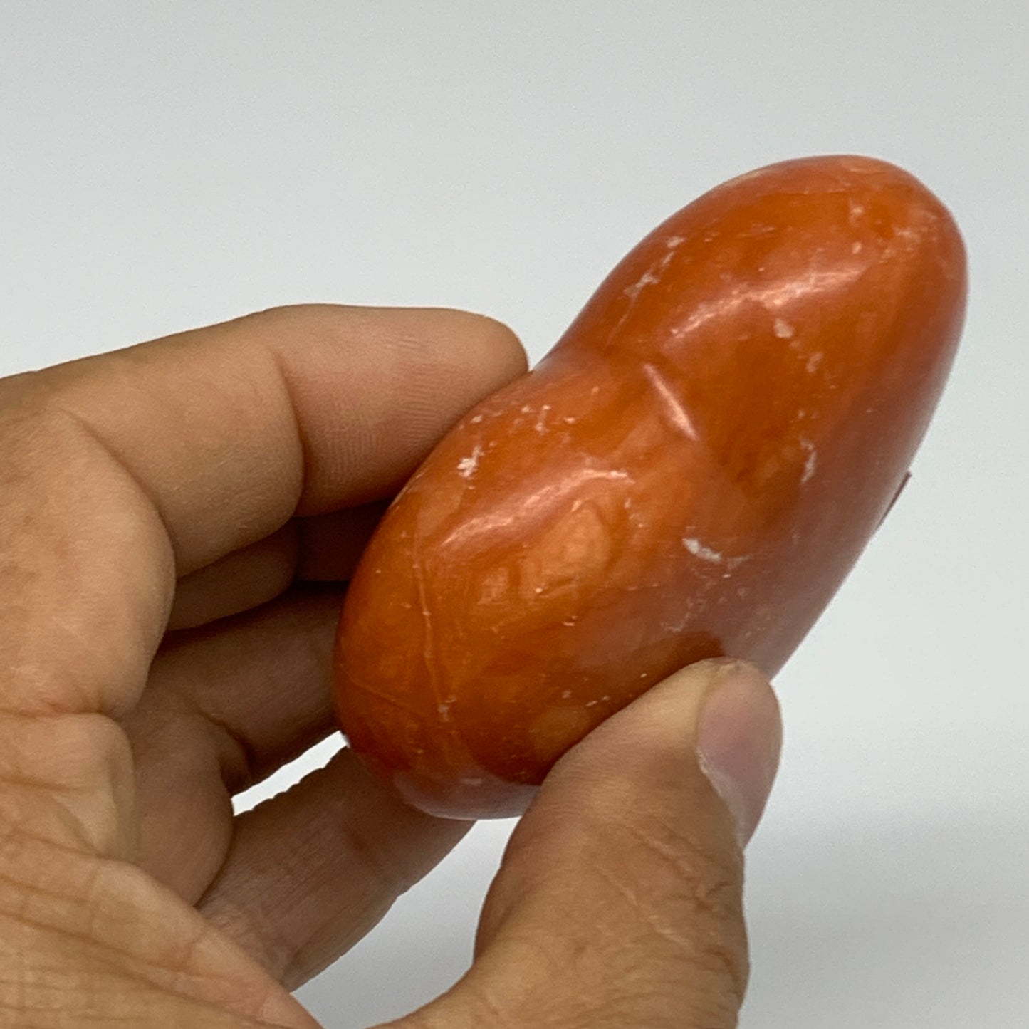 109.9g, 2.2"x2.6"x1" Orange Calcite Heart Gemstones from Madagascar, B33784