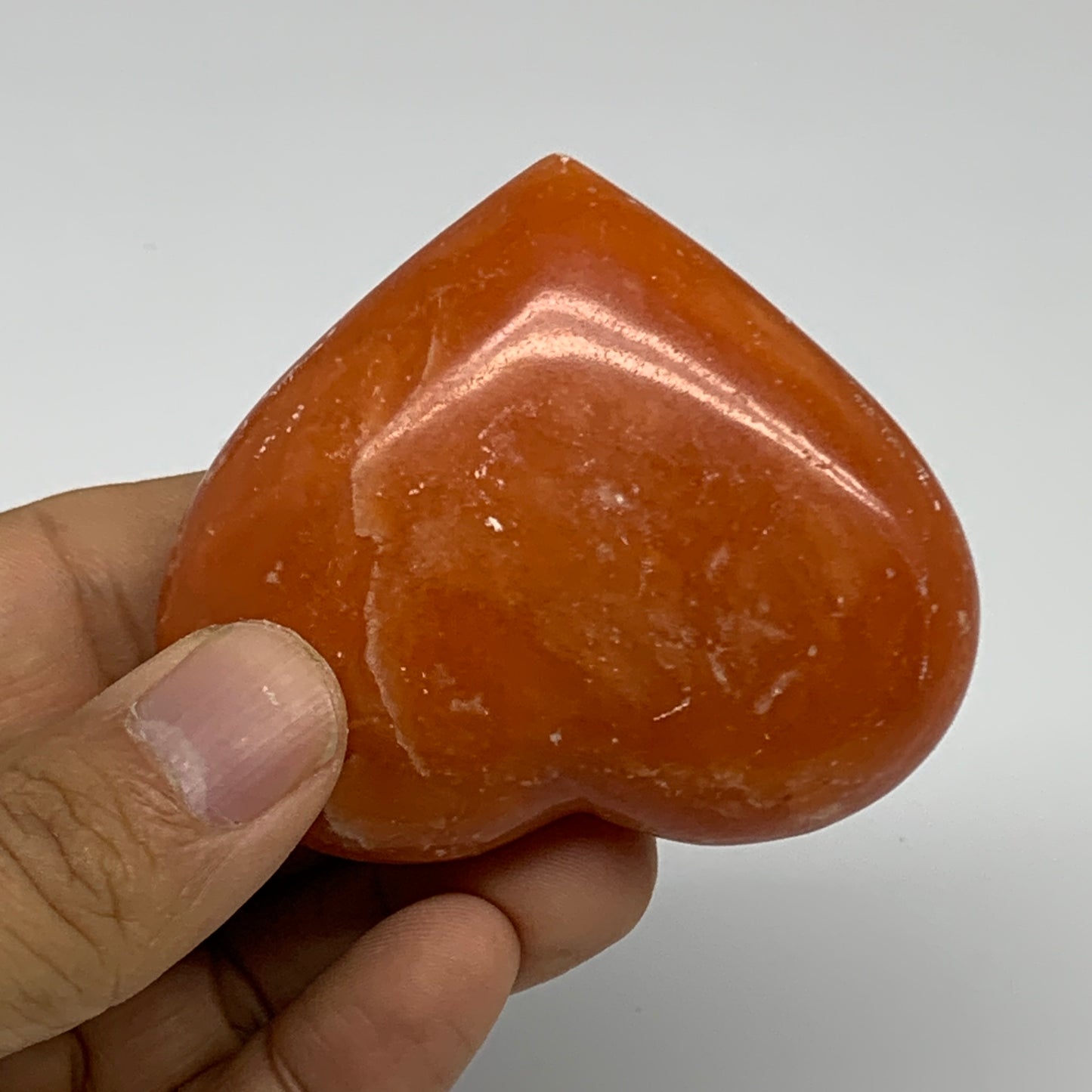 109.9g, 2.2"x2.6"x1" Orange Calcite Heart Gemstones from Madagascar, B33784