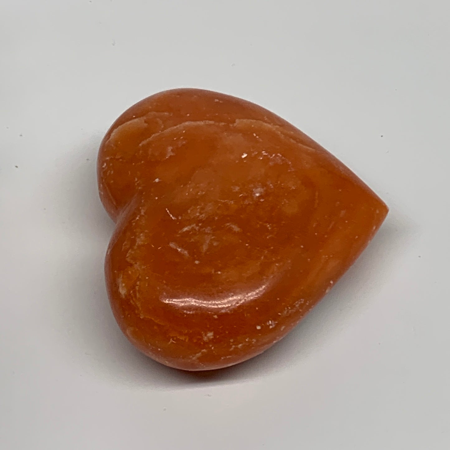 109.9g, 2.2"x2.6"x1" Orange Calcite Heart Gemstones from Madagascar, B33784