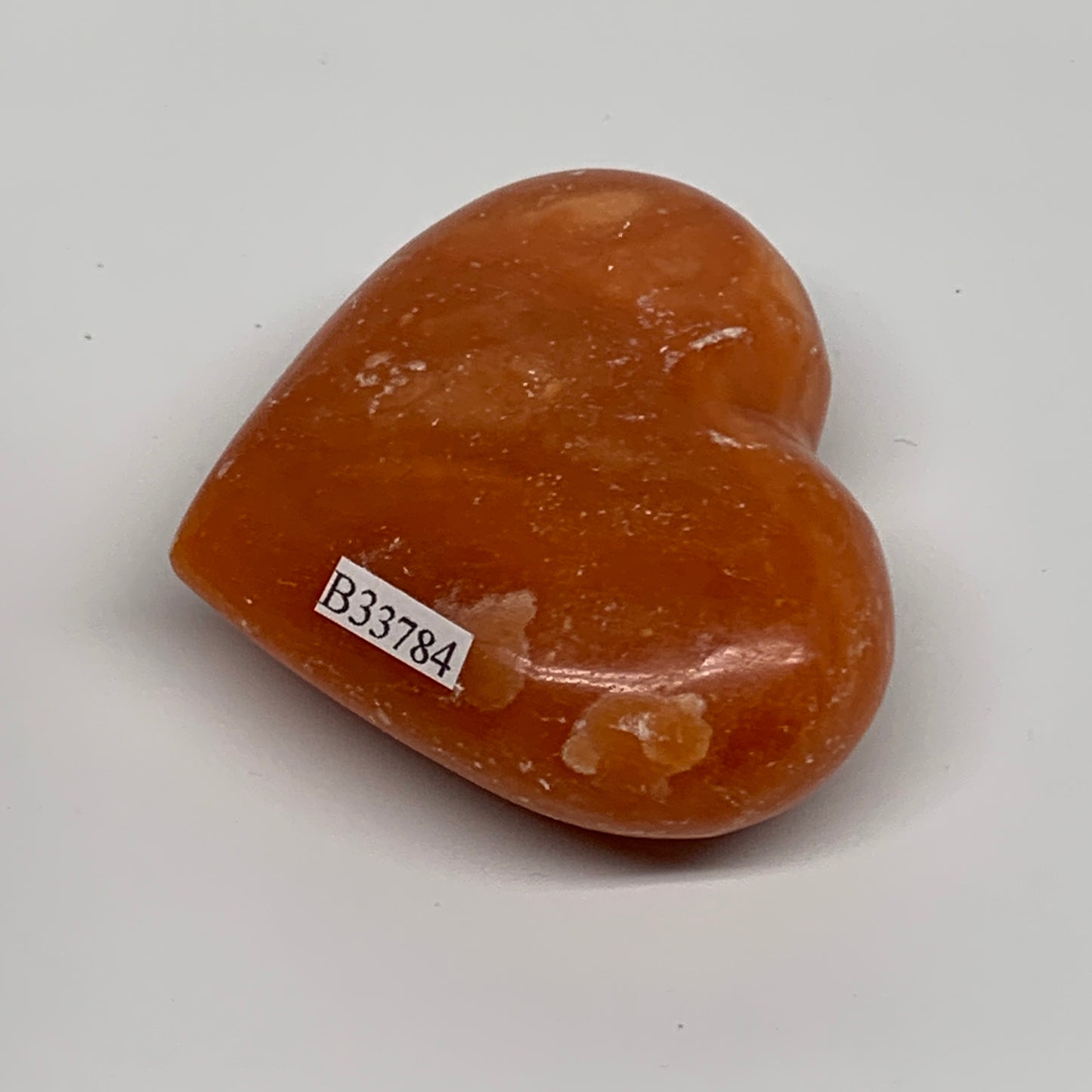 109.9g, 2.2"x2.6"x1" Orange Calcite Heart Gemstones from Madagascar, B33784