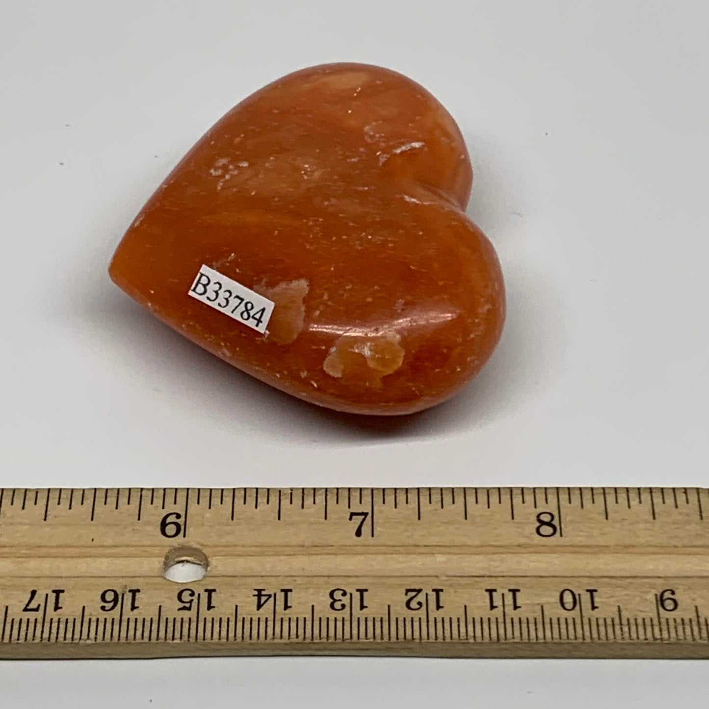 109.9g, 2.2"x2.6"x1" Orange Calcite Heart Gemstones from Madagascar, B33784