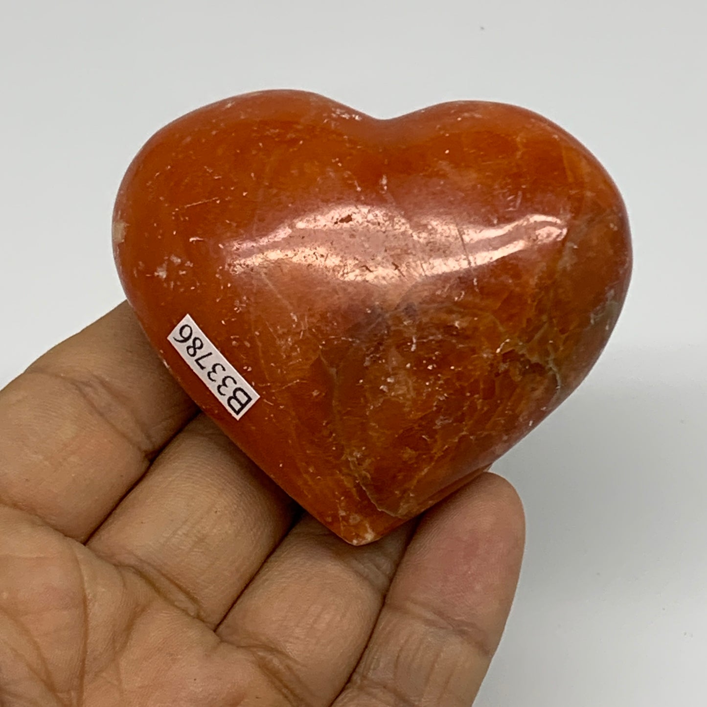 109.9g, 2.2"x2.6"x1" Orange Calcite Heart Gemstones from Madagascar, B33786